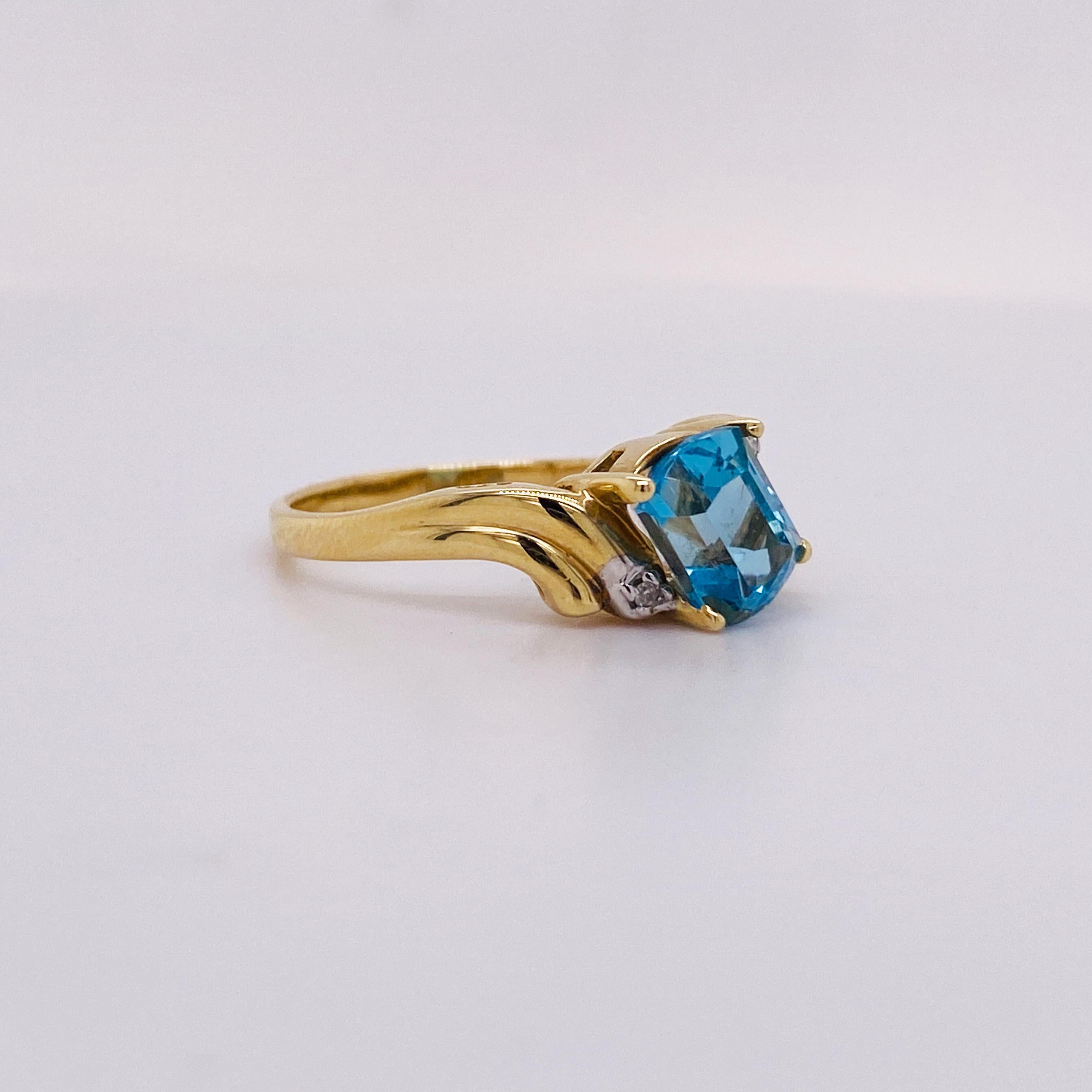 Contemporary 1.25 Carat Fancy Cut Blue Topaz, 14k Gold Bypass Ring with Diamond Accents For Sale
