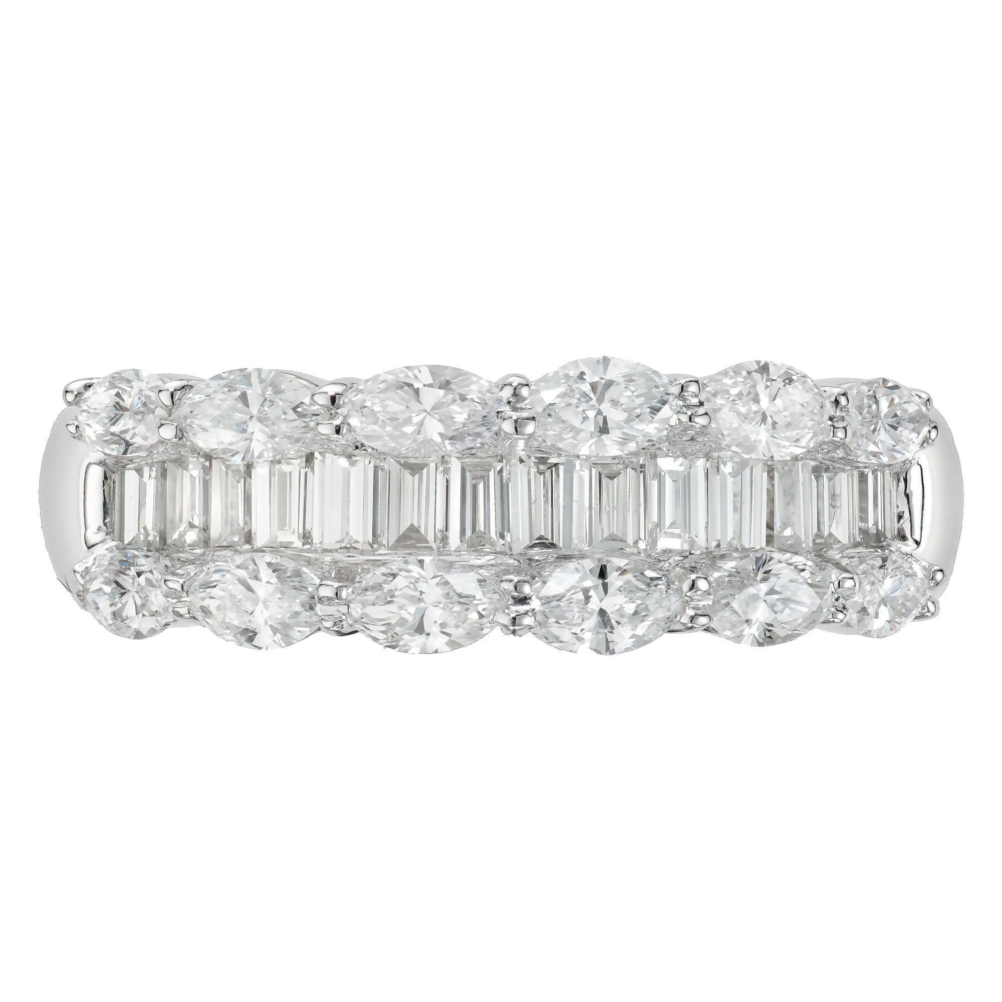 Three-row diamond platinum wedding band ring. 14 step cut baguette diamonds with a row of 6 marquise cut diamonds on each side in a platinum setting.

12 marquise diamonds, H VS-SI approx. .65cts
14 step cut baguette diamonds, H VS approx.
