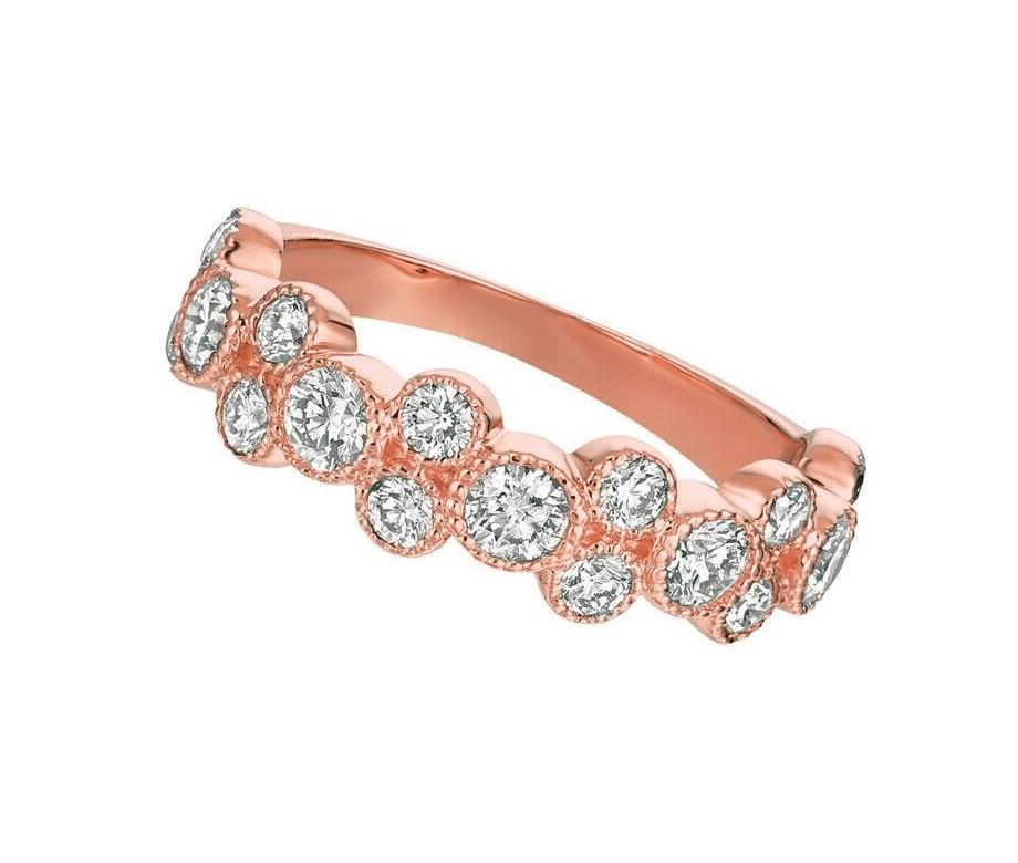 1.25 Ct Natural Round Cut Diamond Ring G SI 14K Rose Gold

100% Natural Diamonds, Not Enhanced in any way 
1.25CT
G-H 
SI  
14K Rose Gold,  Pave & Bezel style,   3.70 grams
1/4 inch in width
Size 7
5 diamonds - 0.66ct, 12 diamonds - 0.59ct

ALL OUR