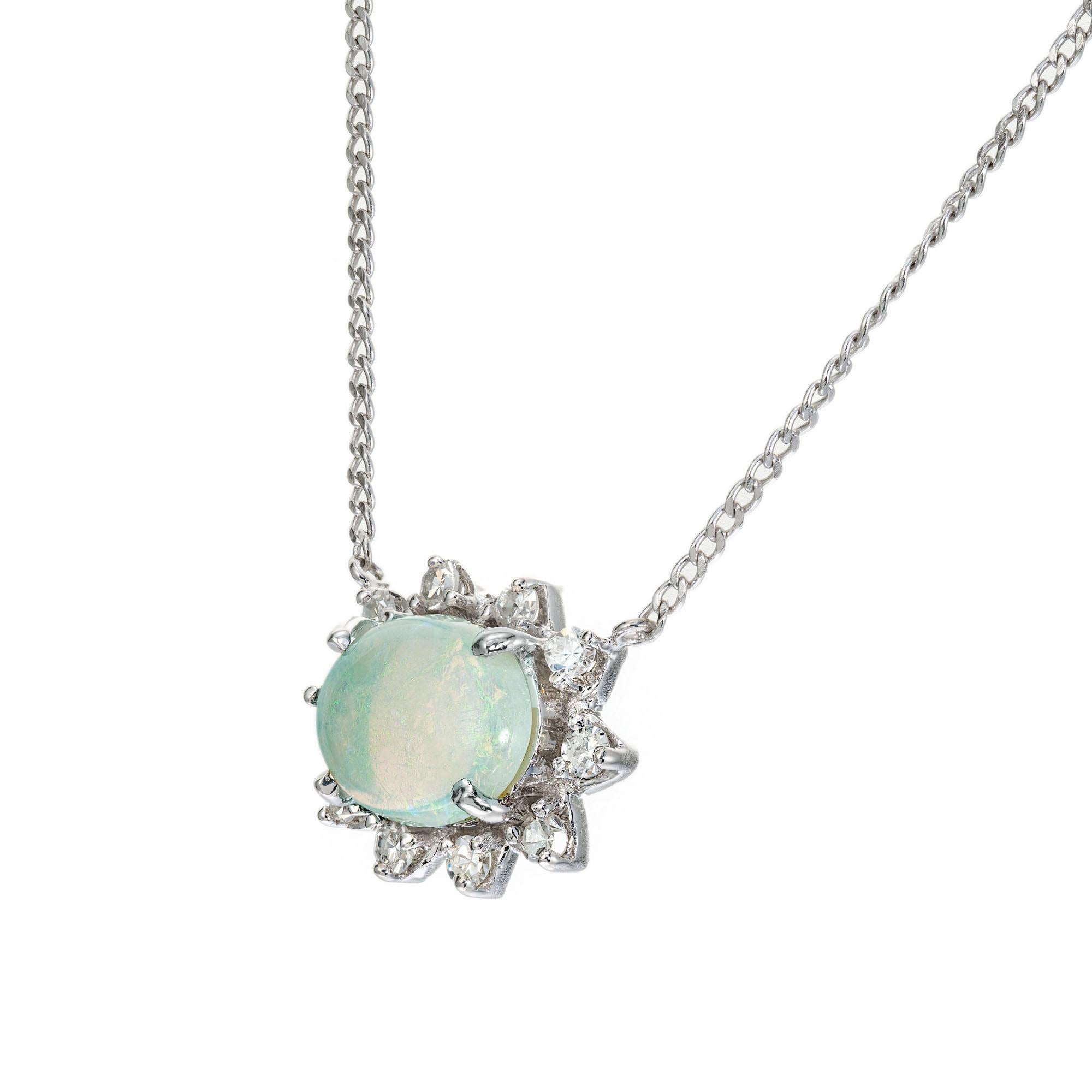 1940's late Art Deco Opal and diamond necklace. 1.25ct oval natural Australian bluish green cabochon opal with a halo of 10 sing cut diamonds. 16 inches. 

1 oval cabochon bluish green opal, approx. 1.25cts
10 single cut diamonds, G VS SI approx.