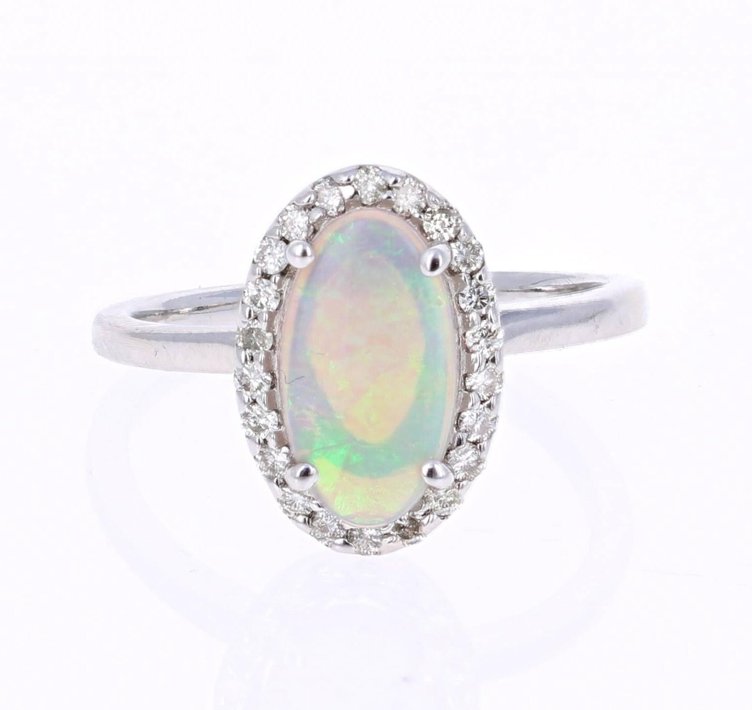 1.25 Carat Oval Cut Opal Diamond White Gold Cocktail Ring!

Cute and dainty ring that can be a great addition to anyone's accessory collection!   This ring has a 1.00 carat Oval Cut Opal that is set in the center of the ring and is surrounded by 22
