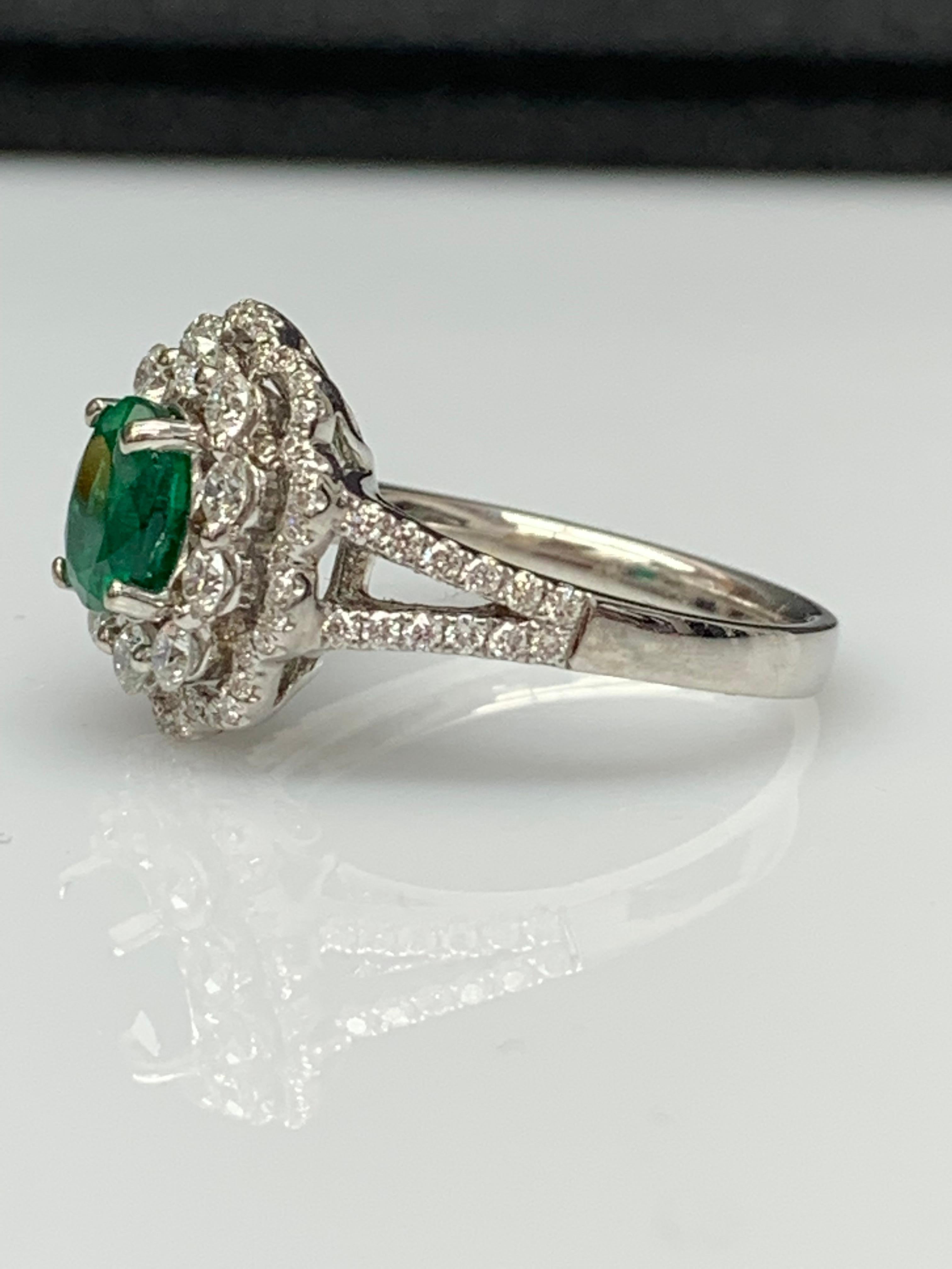 Modern 1.25 Carat Oval Emerald and Diamond Cocktail Flower Ring in 18K White Gold For Sale