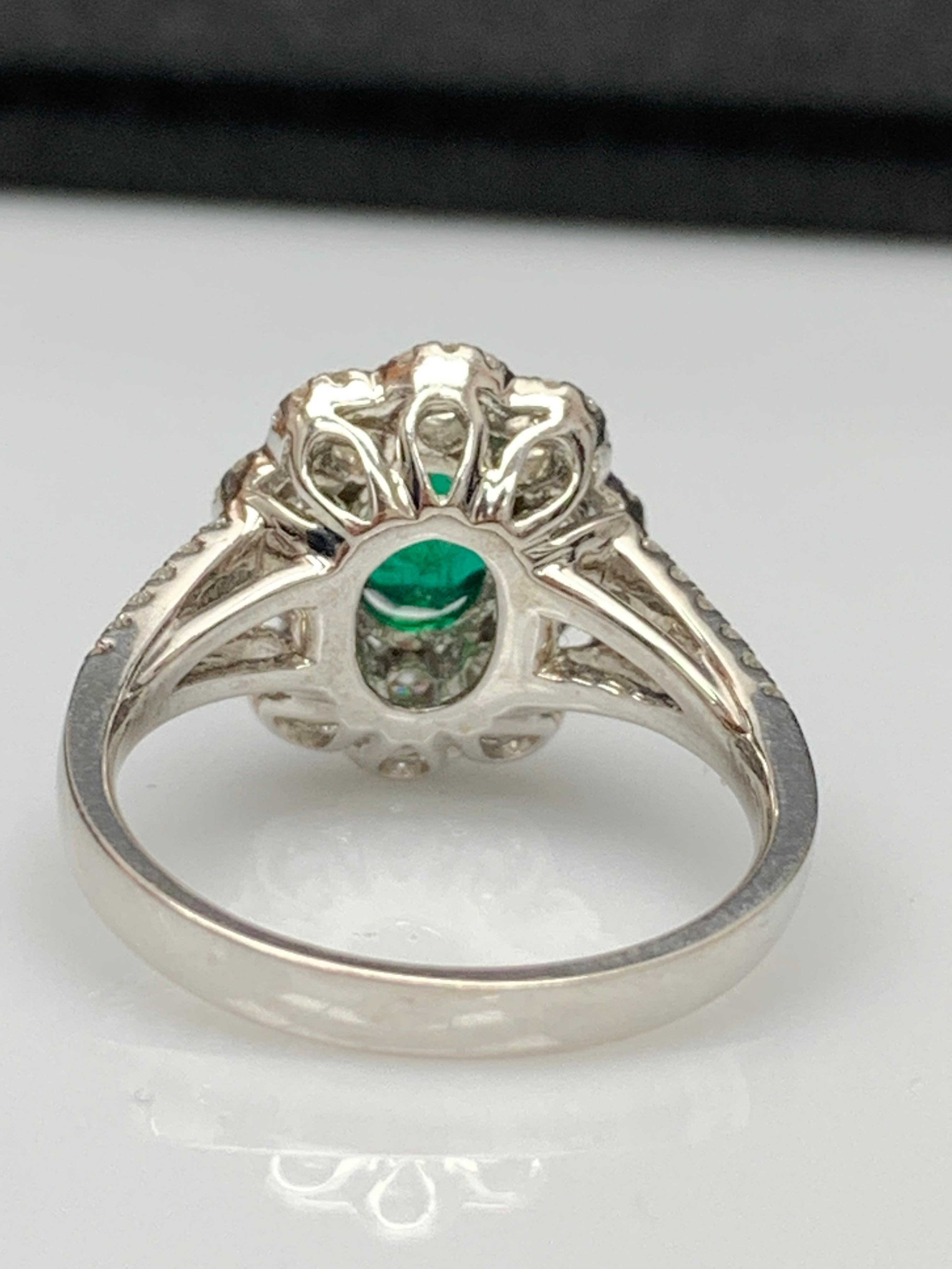Oval Cut 1.25 Carat Oval Emerald and Diamond Cocktail Flower Ring in 18K White Gold For Sale