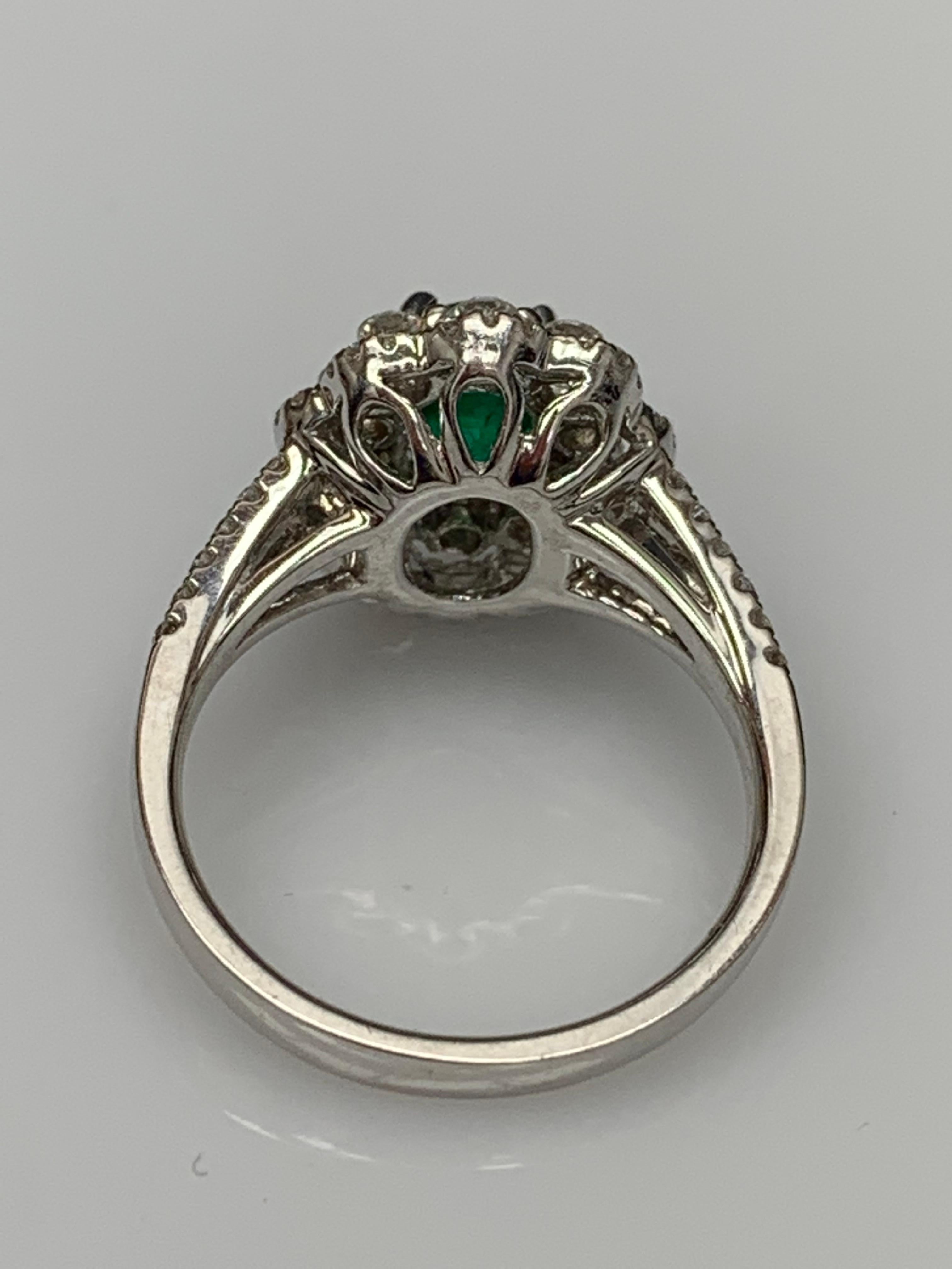 1.25 Carat Oval Emerald and Diamond Cocktail Flower Ring in 18K White Gold In New Condition For Sale In NEW YORK, NY