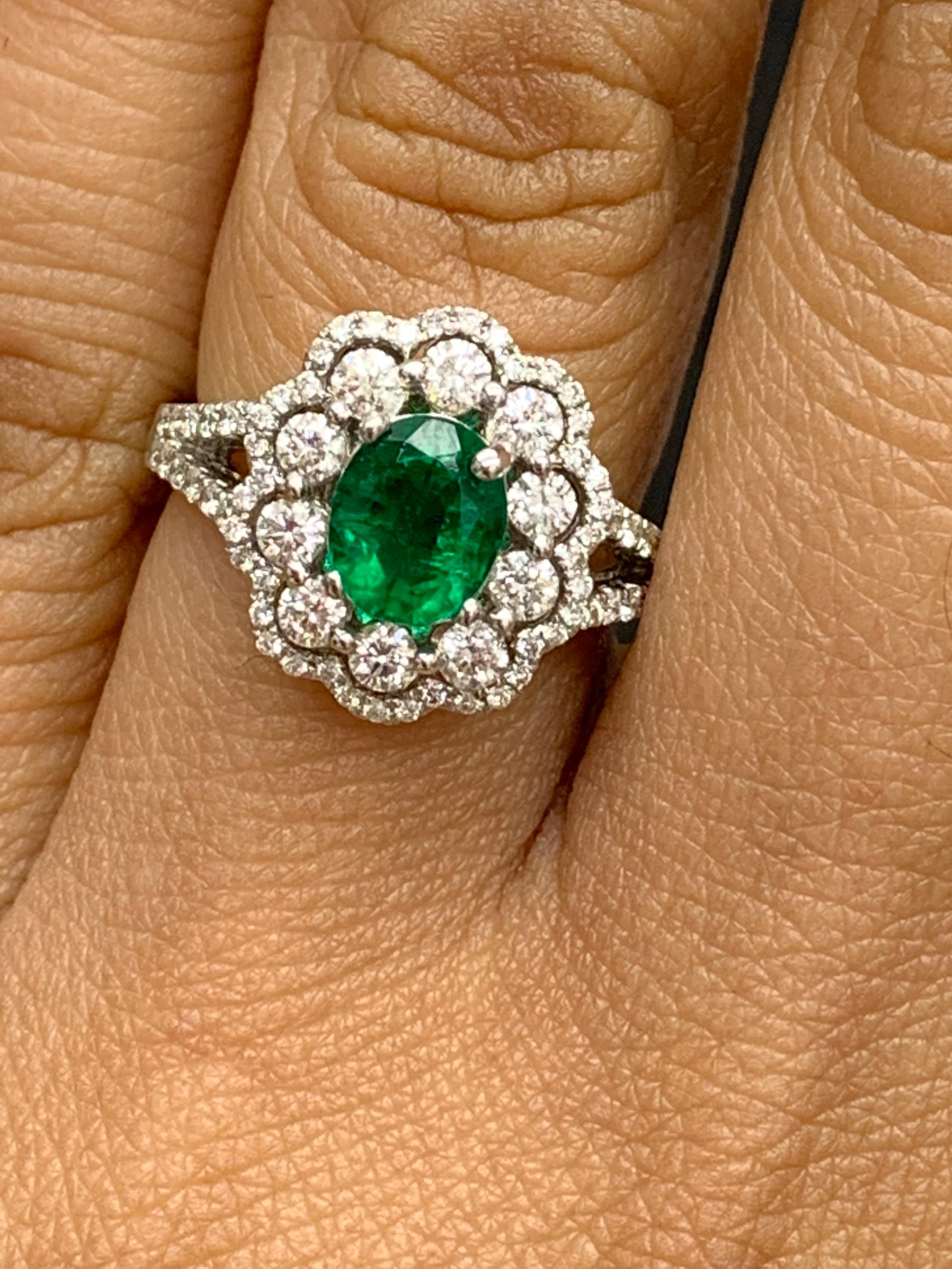 Women's 1.25 Carat Oval Emerald and Diamond Cocktail Flower Ring in 18K White Gold For Sale
