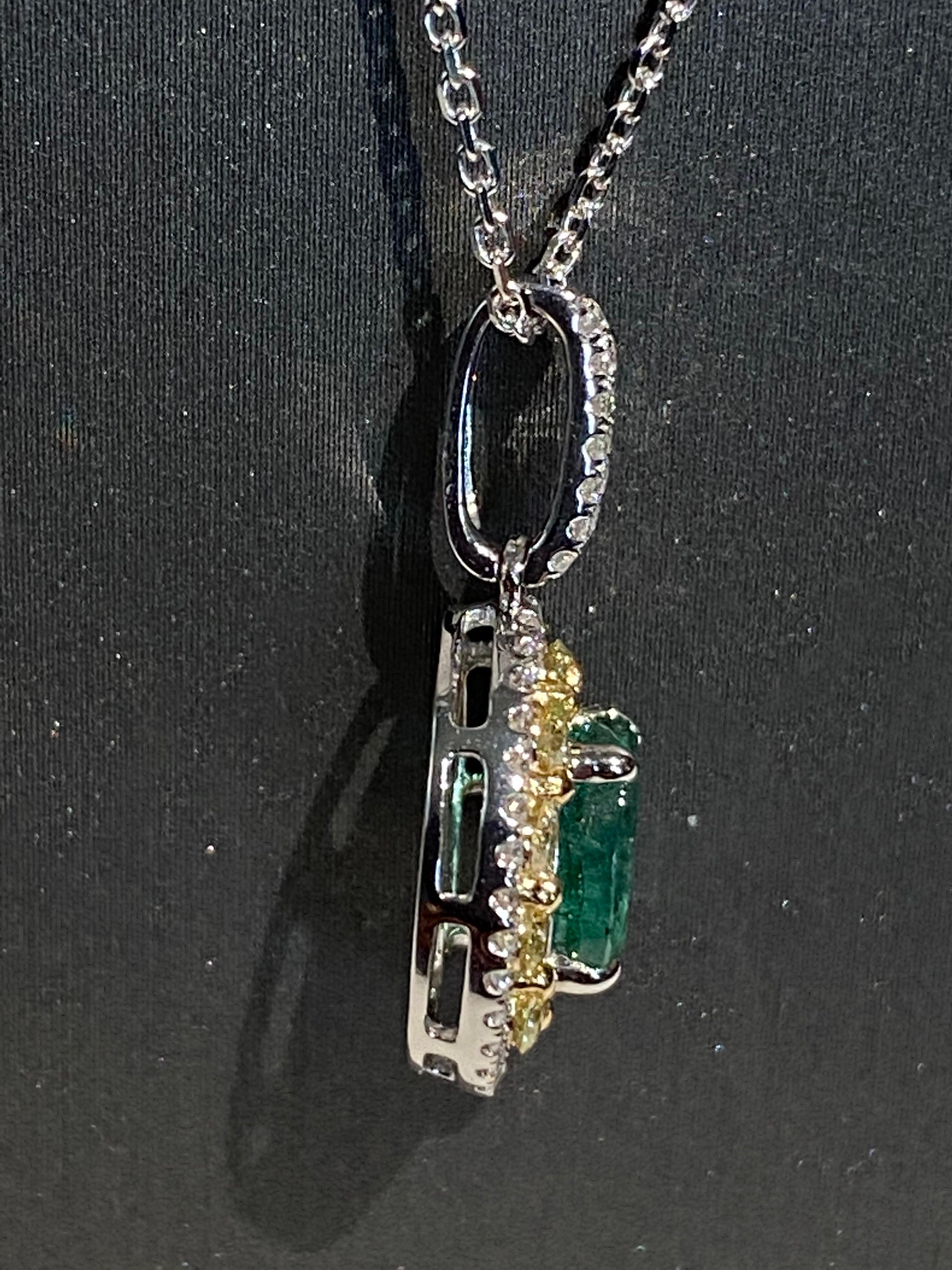 Oval emerald has double halo of yellow and white diamonds. Double halo makes the center stone stand out and look bigger. Set in two tone gold, a white gold chain is included. Crafted with hand.
Emerald: 1.25ct
White Diamond: 0.24ct
Yellow Diamond: