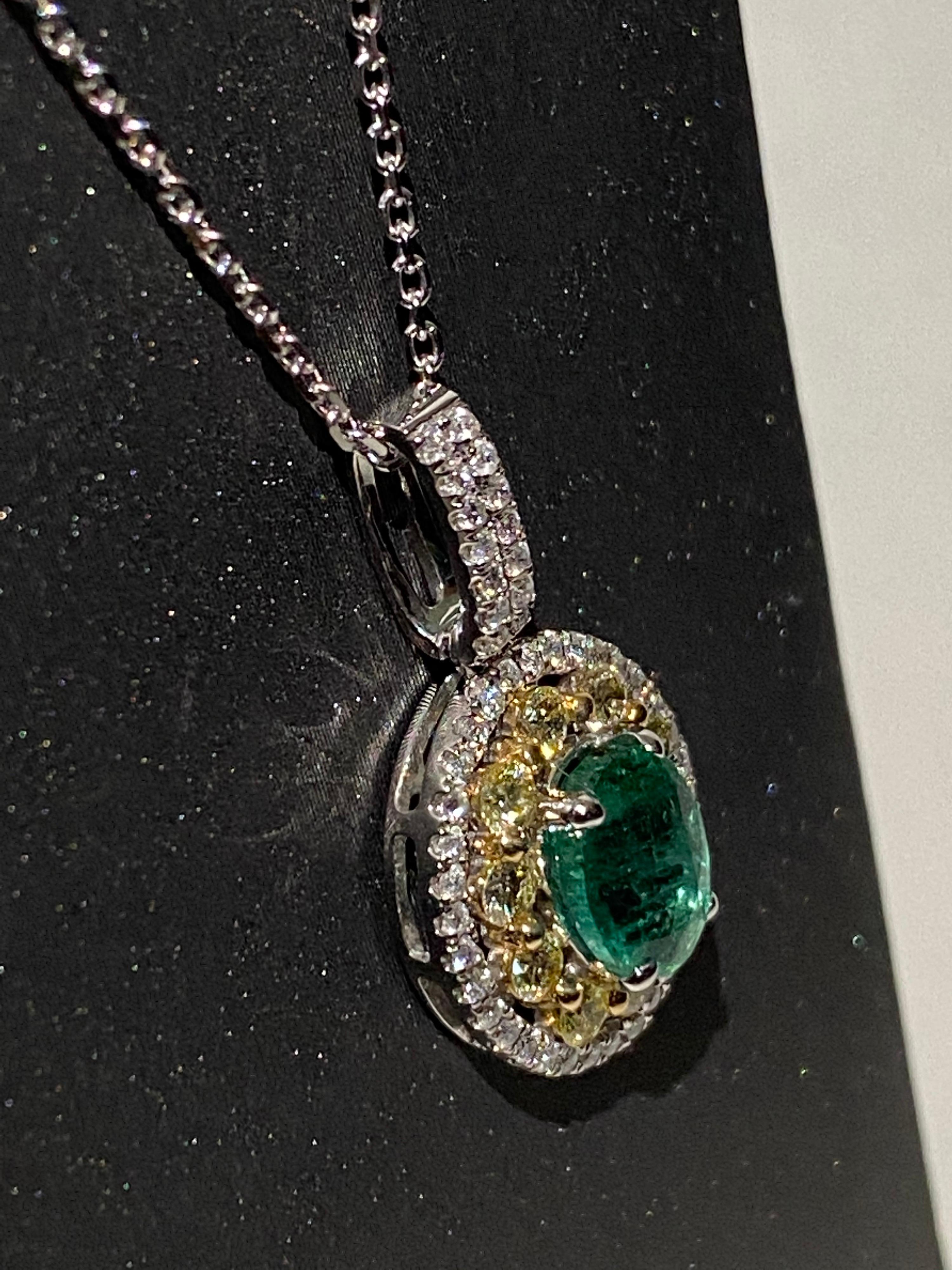 Artisan 1.25 Carat Oval Emerald Diamond Halo Pendant For Sale