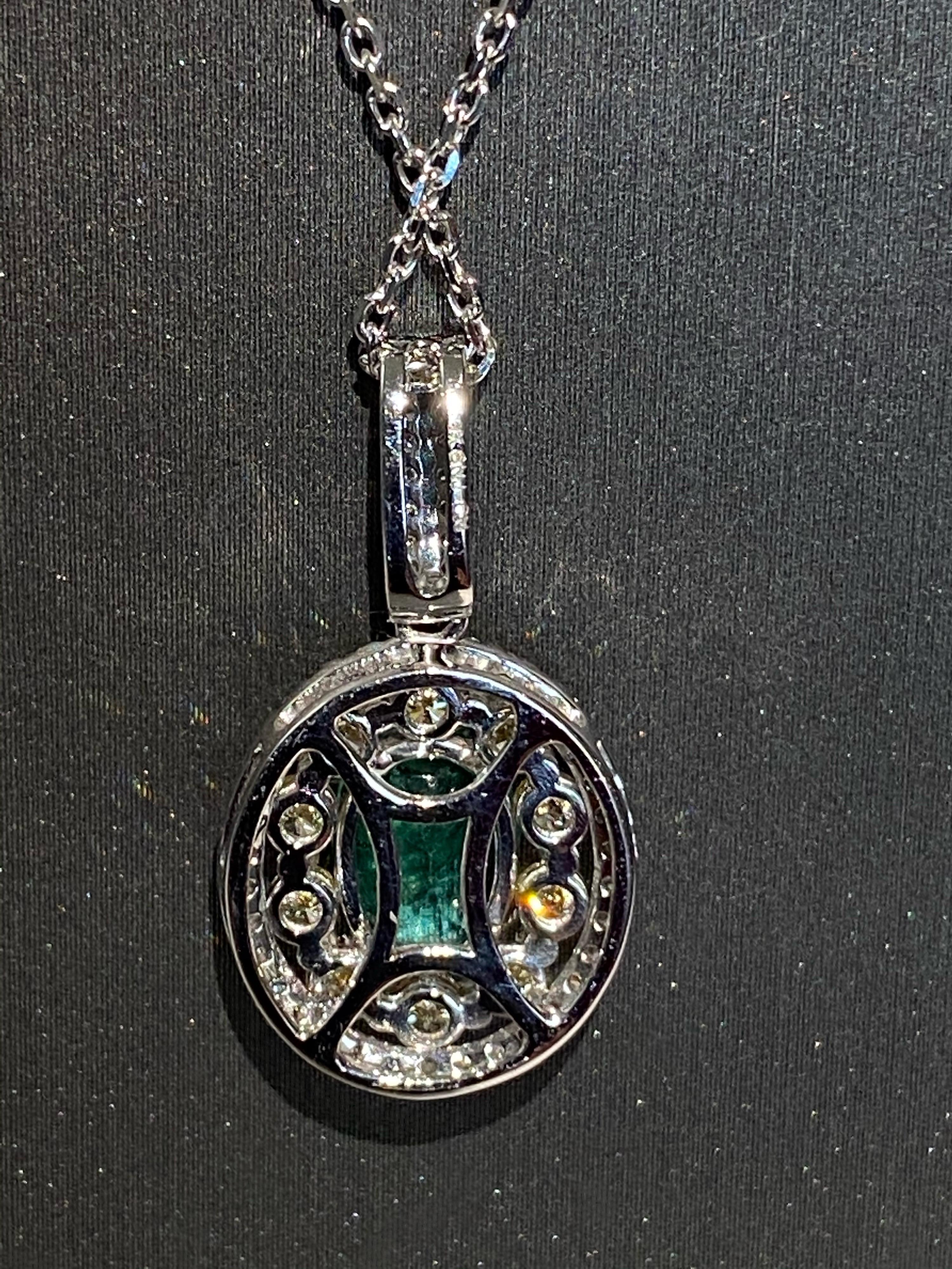 Oval Cut 1.25 Carat Oval Emerald Diamond Halo Pendant For Sale