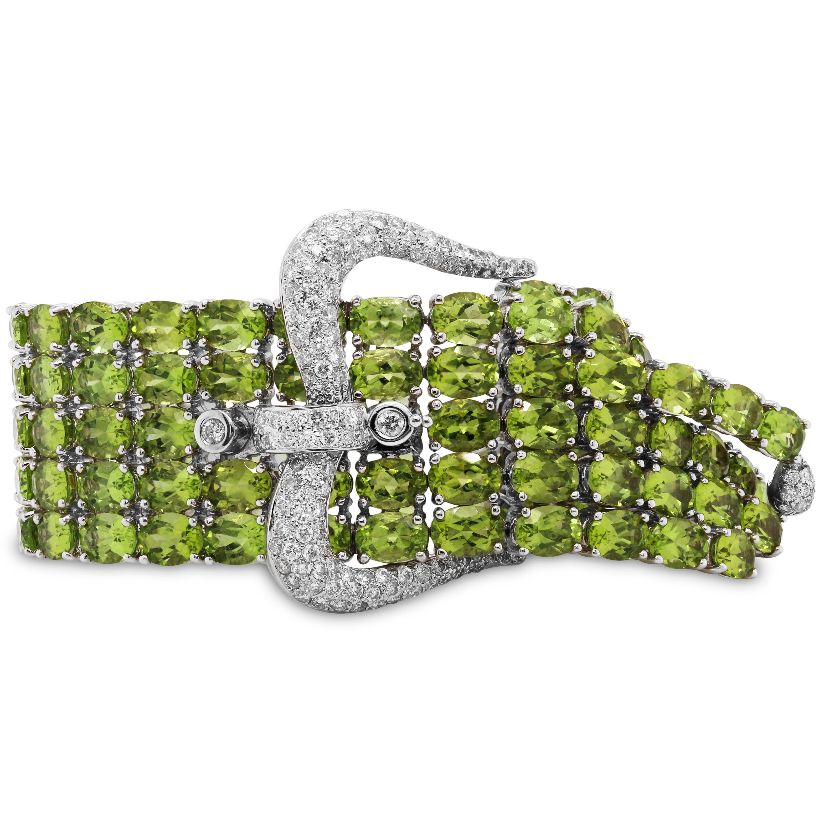 125 Carat Peridot 18K White Gold and Diamonds Buckle Style Five Row Bracelet

This state-of-the-art bracelet features apprx. 125 carats of Peridot. Each are oval cuts. Diamonds are set on the buckle itself along with on the opposite side in white