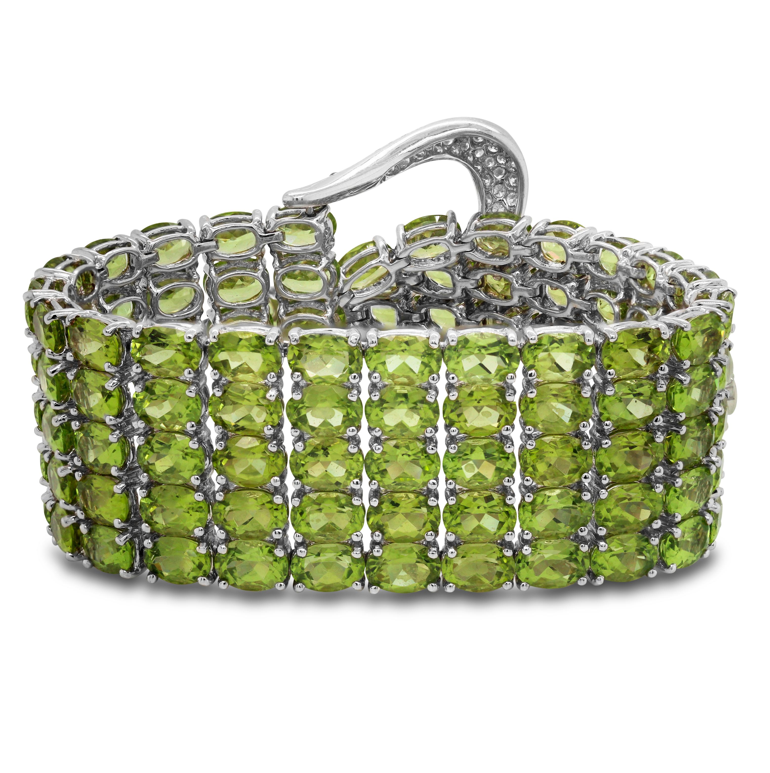 Oval Cut 125 Carat Peridot 18K White Gold and Diamonds Buckle Style Five Row Bracelet For Sale