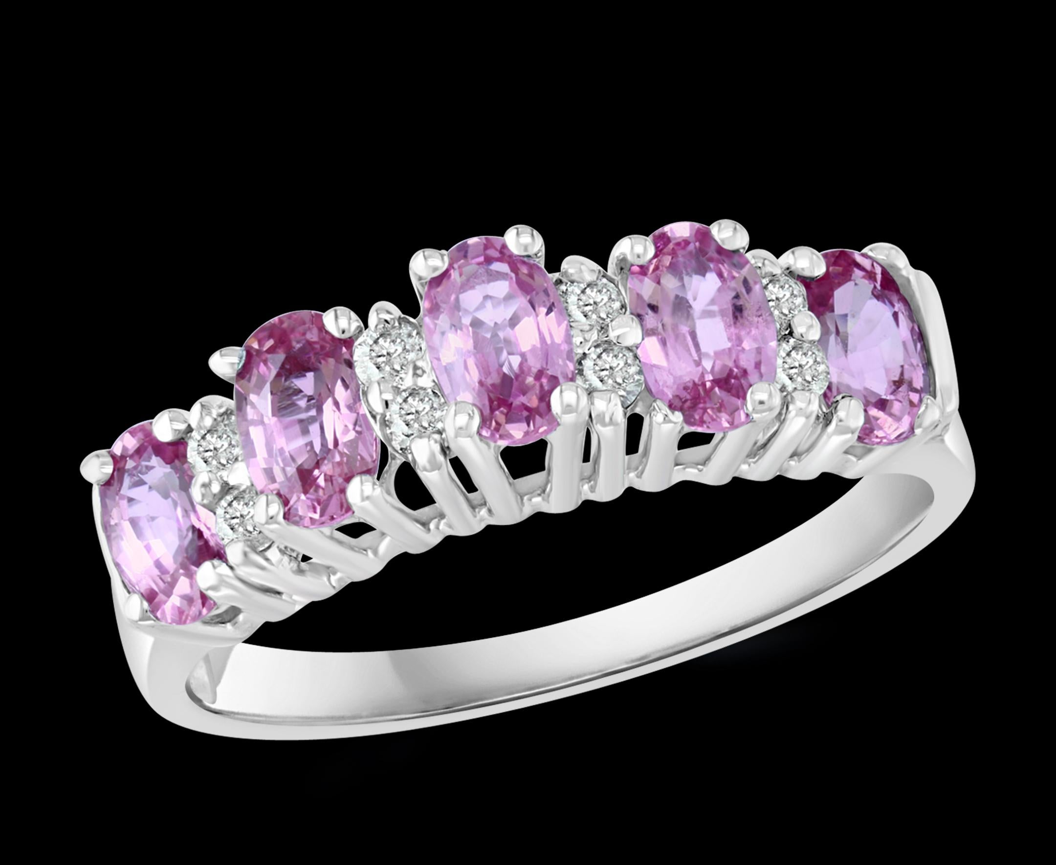 A classic, Cocktail ring 
Approximately 1.25  Ct natural Pink sapphire and Approximately 0.16 Ct  Diamond 14 Karat  White gold   Ring

 All round brilliant cut diamonds
14 Karat White  Gold: 3.1  Grams
 Stamped  for 14 K Gold
Ring Size 6  ( can be