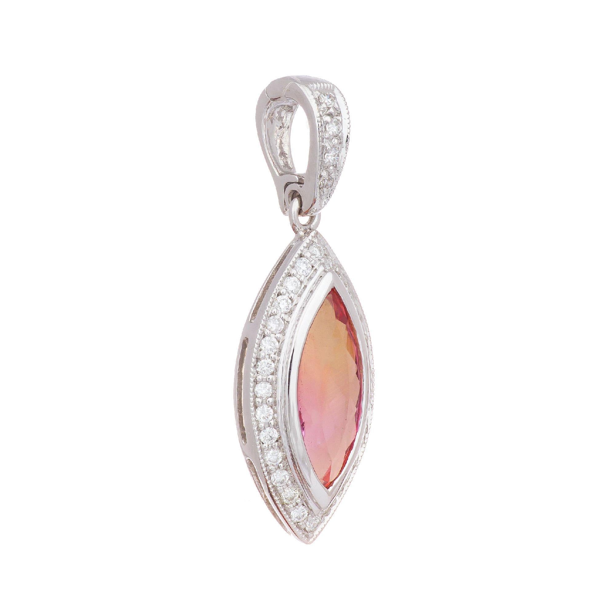 Untreated precious pink marquise shaped Topaz in a halo of 32 round diamonds. Set in a 14k white gold pendant setting. 

1 Marquise natural precious pink Topaz, approx. total weight 1.25cts, VS, 11 x 4.7mm
32 full cut round diamonds, approx. total