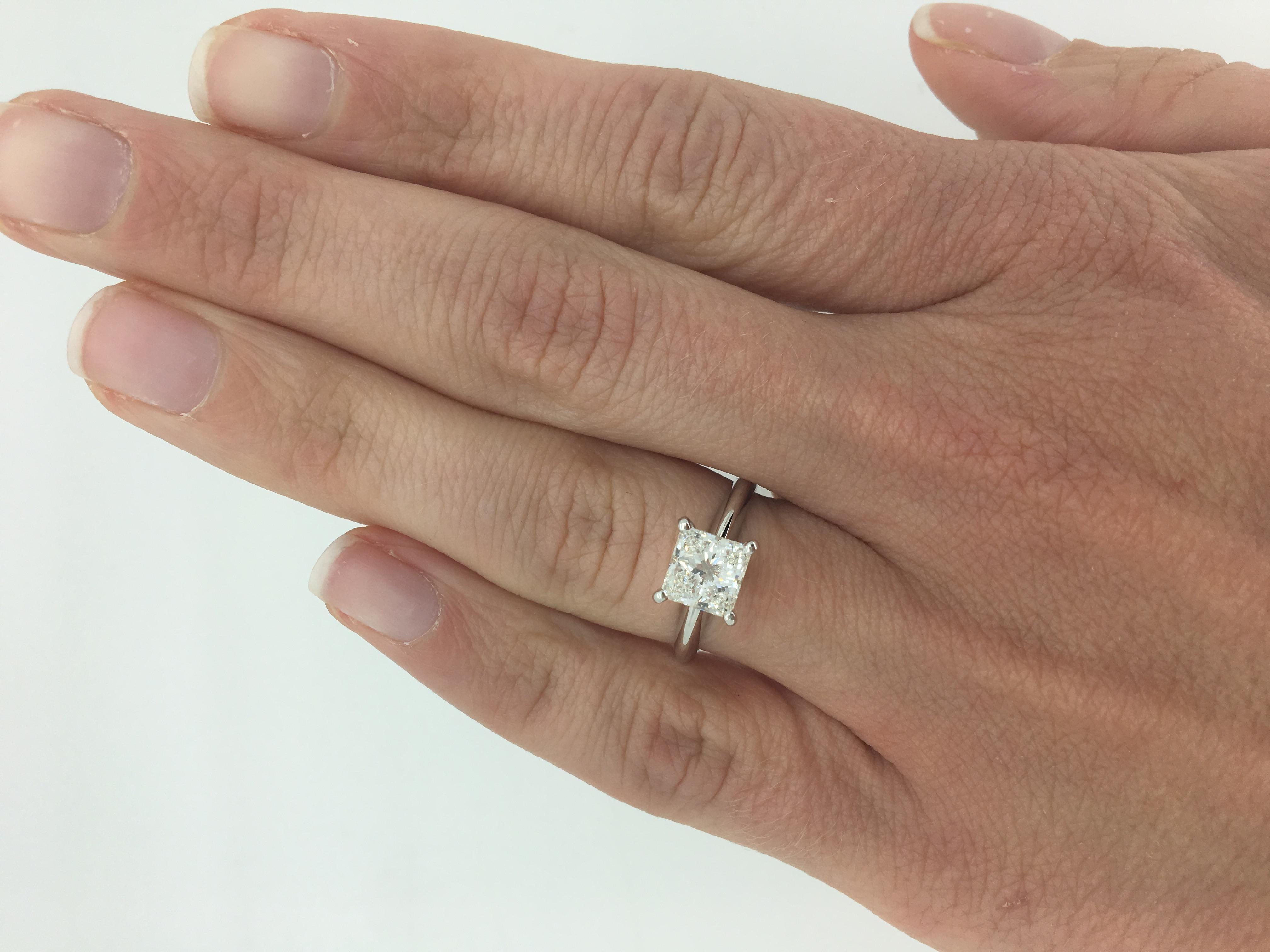 This stunning solitaire engagement ring features an approximately 1.25CT Princess Cut Diamond.

Diamond Carat Weight: Approximately 1.25CT
Diamond Cut: Princess Cut
Diamond Color: I-J 
Diamond Clarity:  SI1
Metal: Platinum
Ring Size: