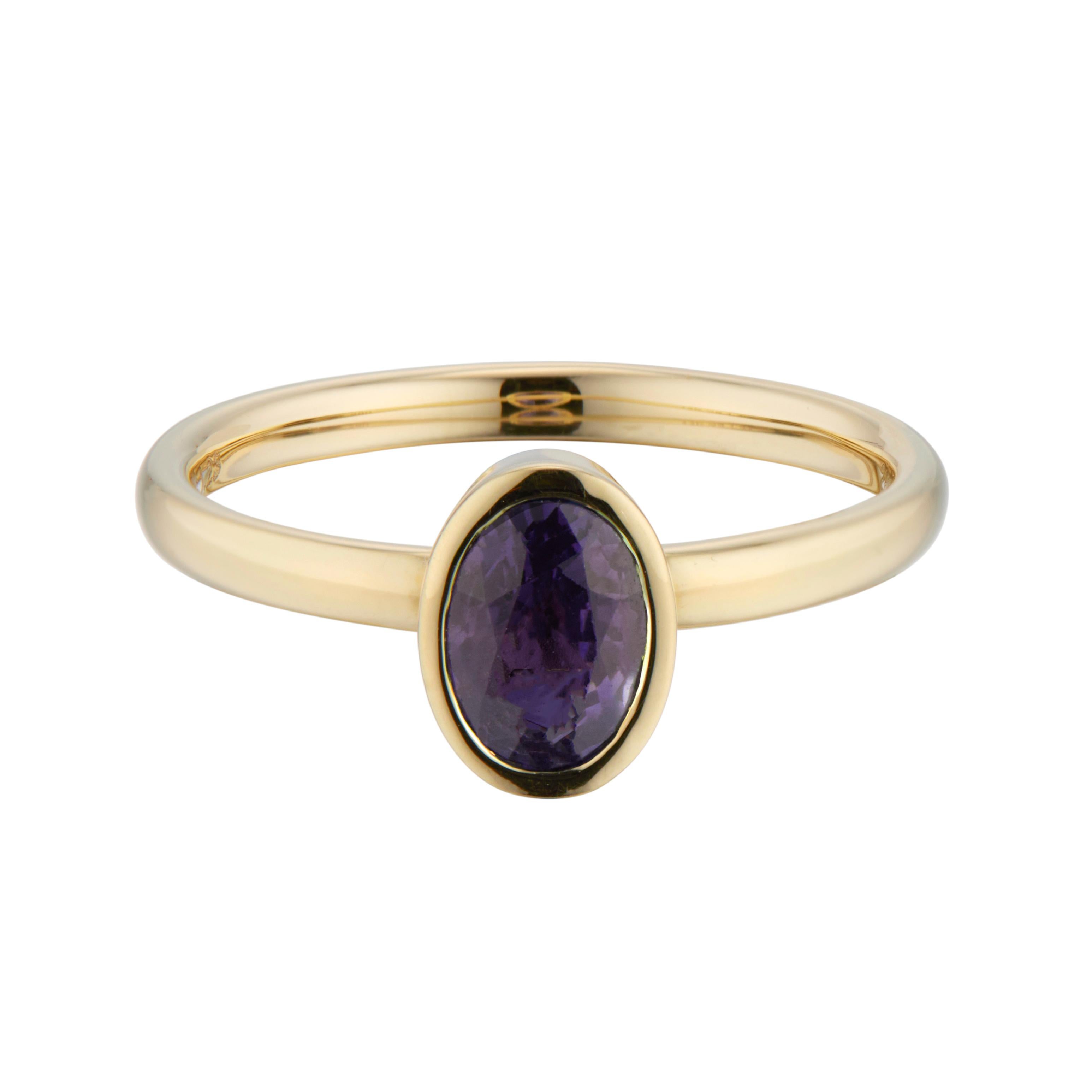 Sapphire engagement ring. Oval sapphire bezel set center stone in a 14k yellow gold setting. 

1 oval purple sapphire, approx. 1.25cts
Size 7 and sizable
14k yellow gold 
Stamped: 14k
2.9 grams
Width at top: 8.4mm
Height at top: 5.4mm
Width at