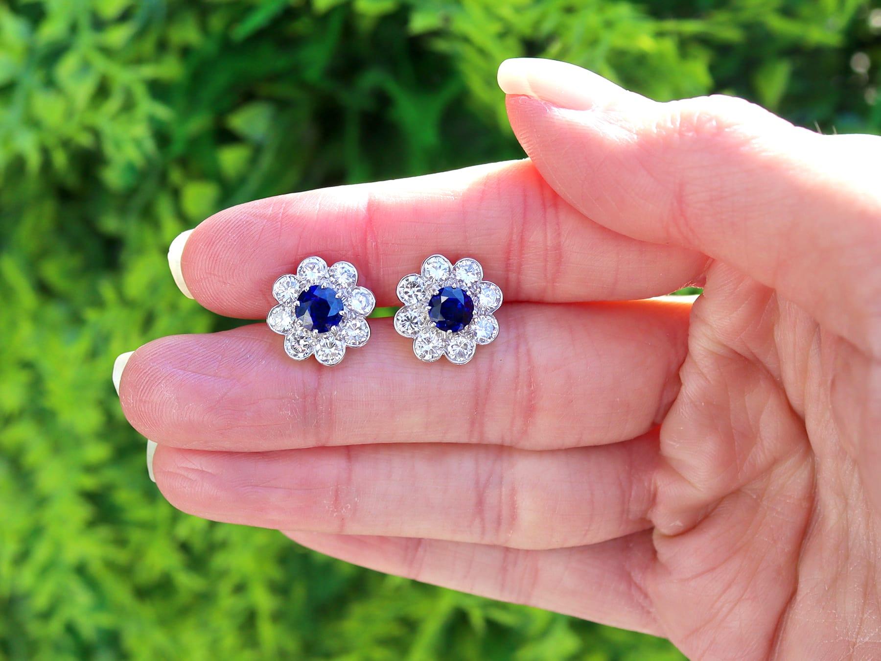 A fine and impressive 1.25 carat sapphire and 1.70 carat diamond, 18 karat yellow gold and platinum set cluster earrings; part of our diverse collection of sapphire jewelry.

These stunning, fine and impressive vintage sapphire earrings have been