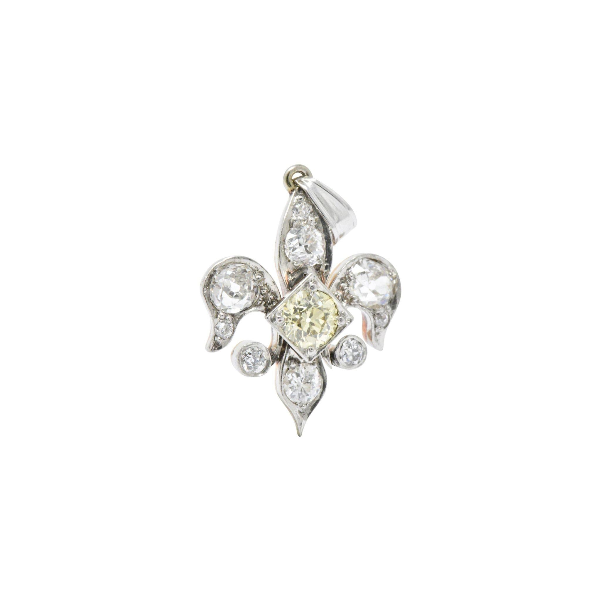 Designed as a Fleur-De-Lis, centering a natural fancy yellow old European cut diamond weighing approximately 0.50 carats total, bright cheerful yellow and VS clarity
Set throughout with old European and mine cut diamonds, approximately 0.75 carats