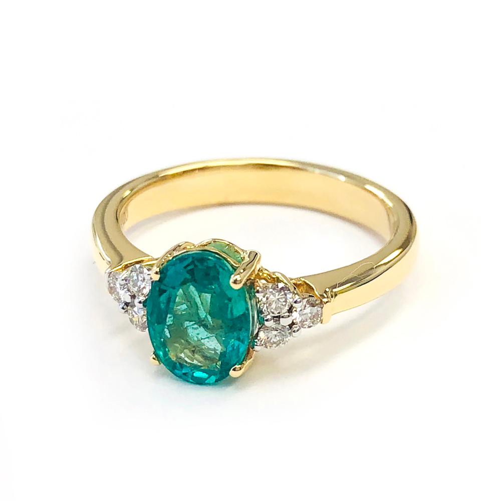 Oval Cut 1.25 Carat Zambian Emerald and 0.18 Carats Diamond 14 Karat Gold Bridal Ring For Sale