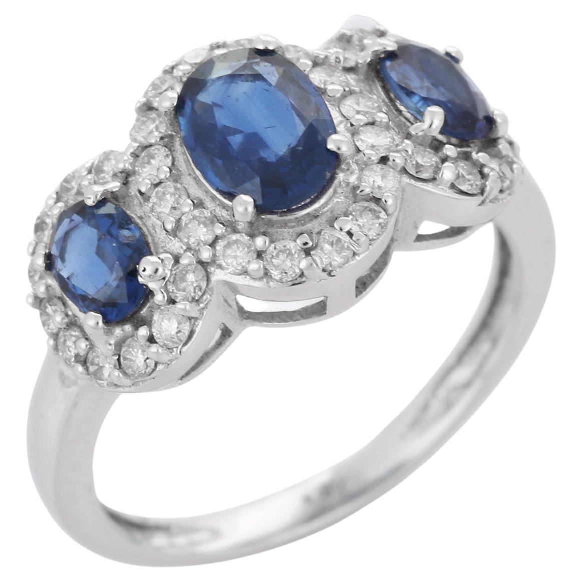 Bague de fiançailles à trois pierres en or blanc massif 18 carats avec halo de diamants et saphirs bleus