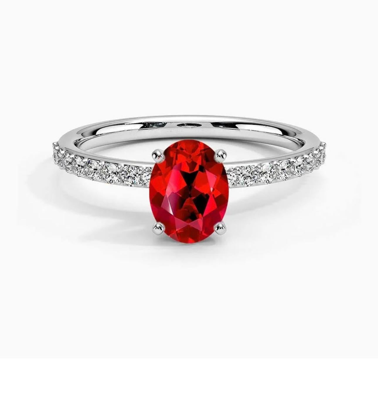  1.25 Ct Oval Cut Treated Ruby & 0.85 Ct Natural Pave Diamond Hidden Halo Engagement Ring with size 5.5 in 14 K white Gold
Introducing a truly stunning piece, behold the 1.25 Carat Oval Ruby & 0.85 ct Diamond Ring in exquisite 14 Karat White Gold.