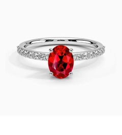 1.25 Ct Oval Cut Treated Ruby & 0.85 Ct Natural Diamond Halo Engagement Ring