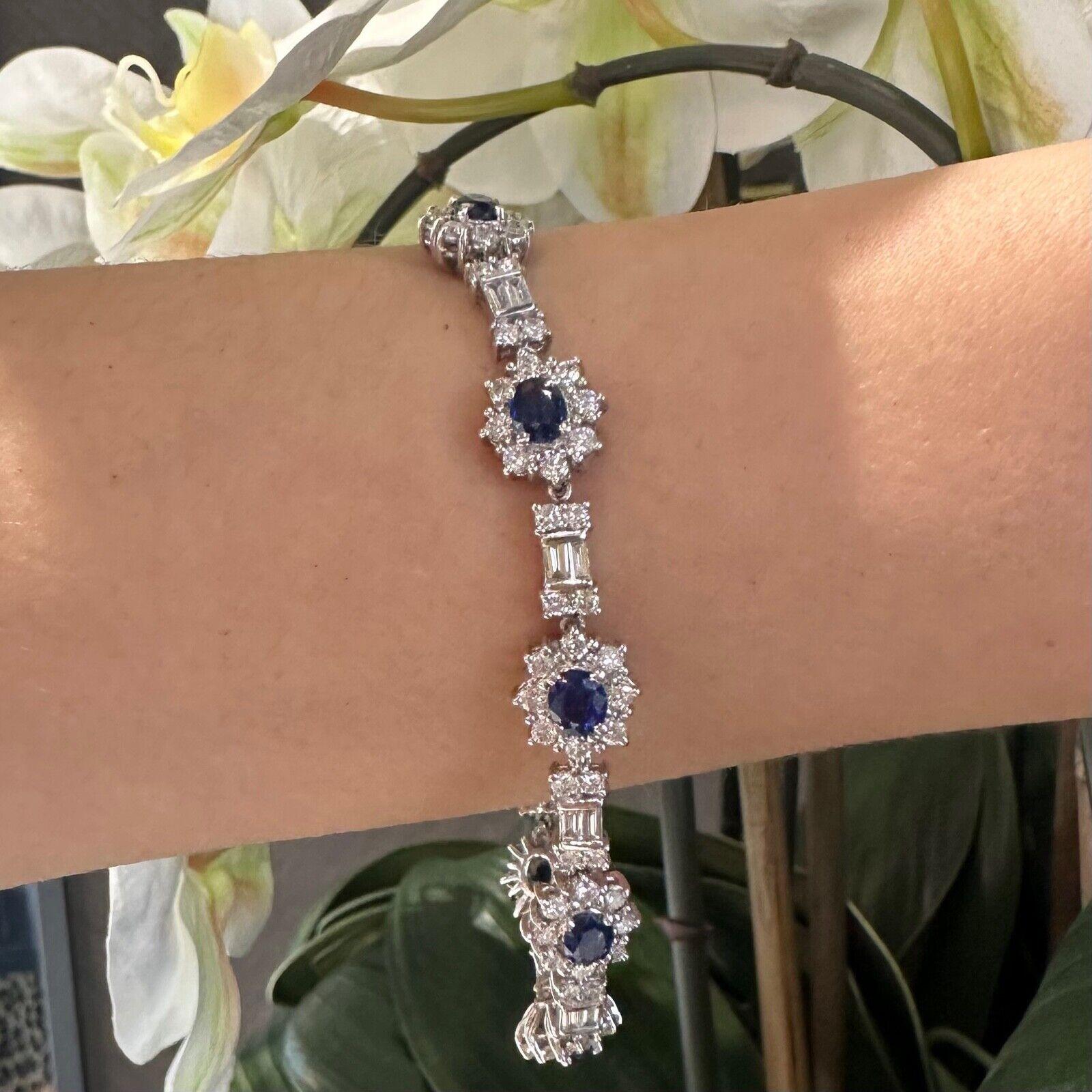 Metal: White Gold

Metal Purity: 18k

Stones: 8 Oval Blue Sapphire Stones, 106 Baguette and Round Diamonds

Diamond Carat Weight: approx. 8ct

Diamond Clarity: VS1 - VS2

Diamond Color: G - H

Sapphire Carat Weight: approx. 4.5 ct

Total Weight