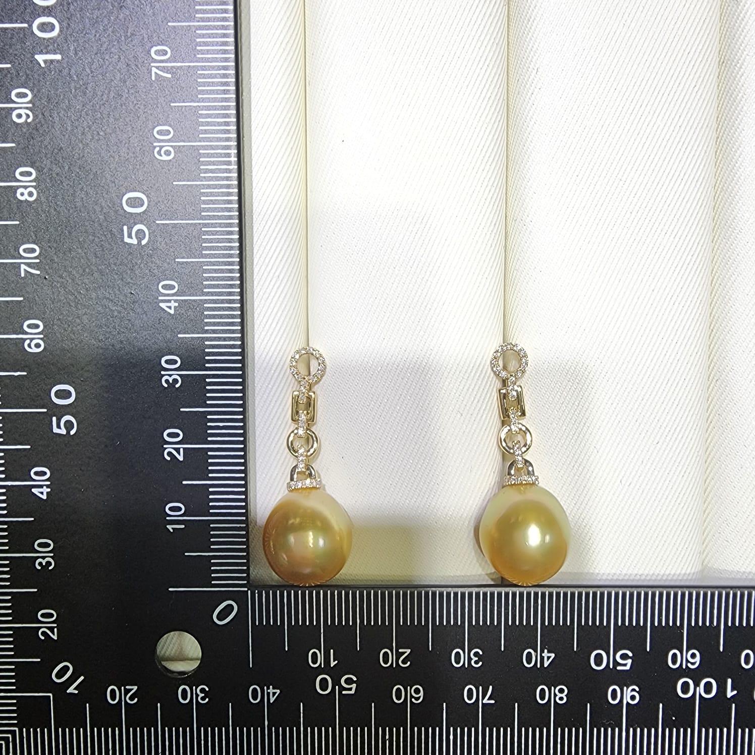 Contemporary 12.5 x 14mm Oval South Sea Pearl Diamond Dangle Earrings in 14 Karat Yellow Gold For Sale