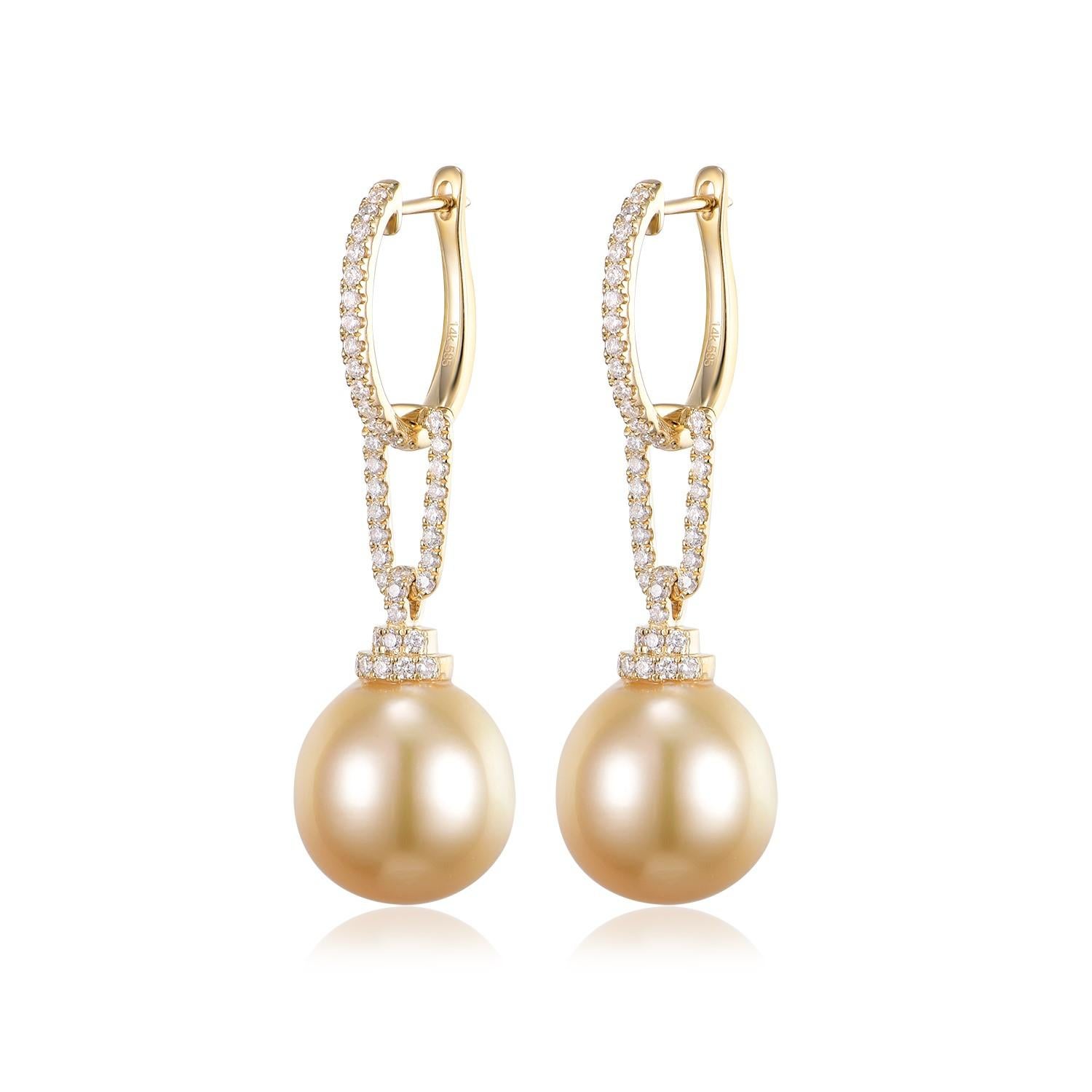 Behold the understated elegance of these 14K yellow gold earrings, each featuring a South Sea pearl with a natural, gentle form. Measuring approximately 12.5 x 15mm, the pearls are not perfectly round, a characteristic that enhances their unique