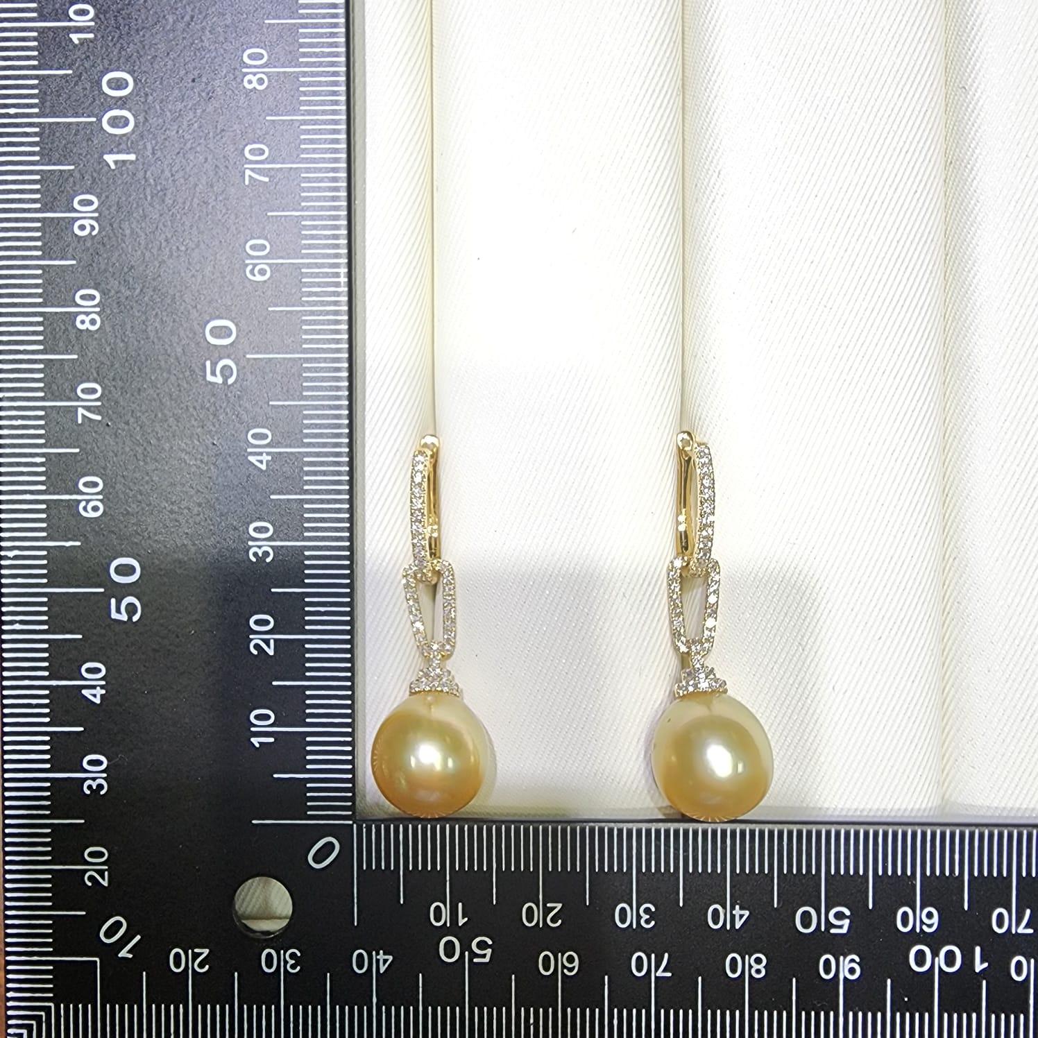 Contemporary 12.5 x 15mm Oval South Sea Pearl Diamond Dangle Earrings in 14 Karat Yellow Gold For Sale
