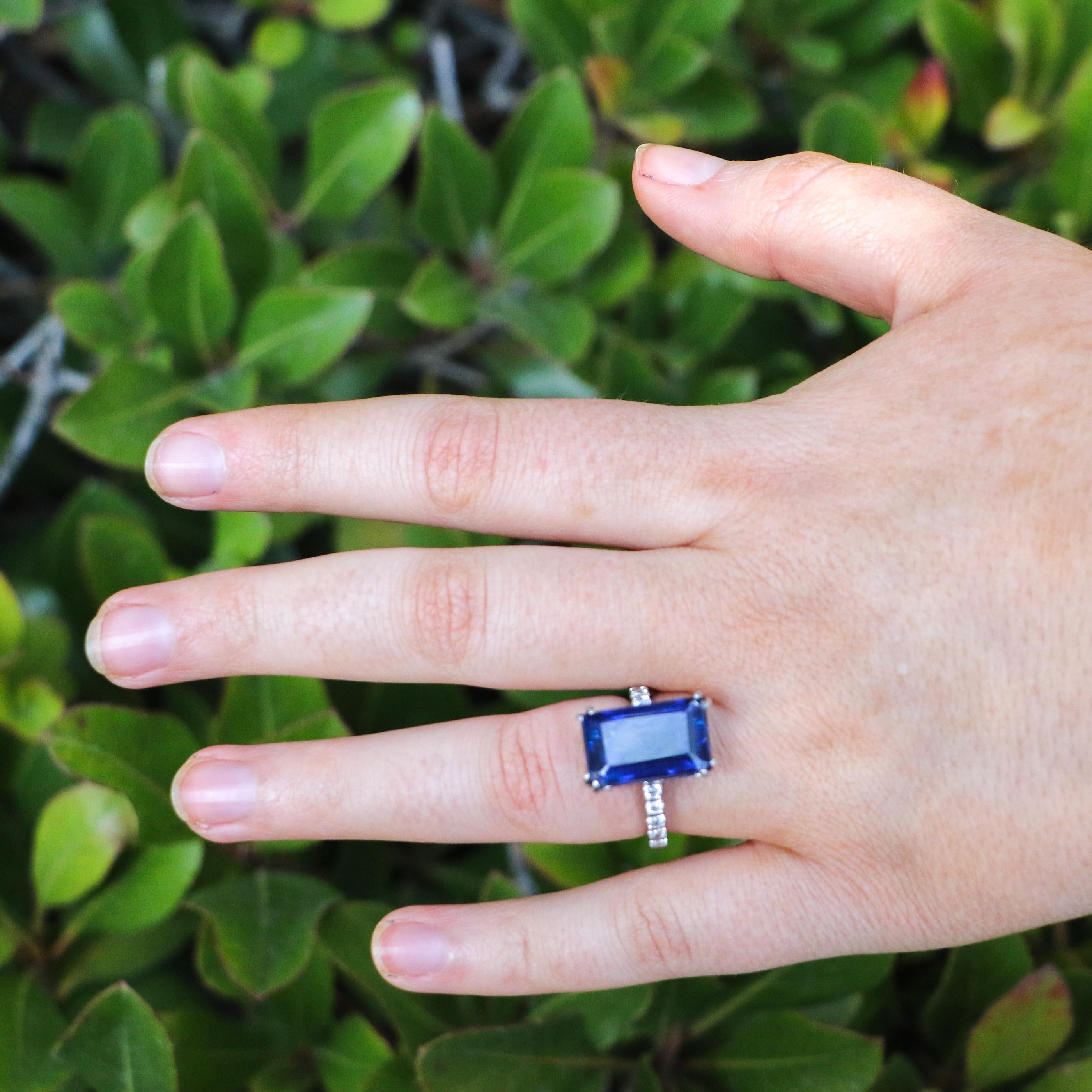 Apart of our wide variety of jewelry for sale. This ring proudly displays a rich and deep blue kyanite with eight prongs holding it in with minimal interruption. Diamonds line the front of the band adding sparkle to this ring, each diamond is bezel