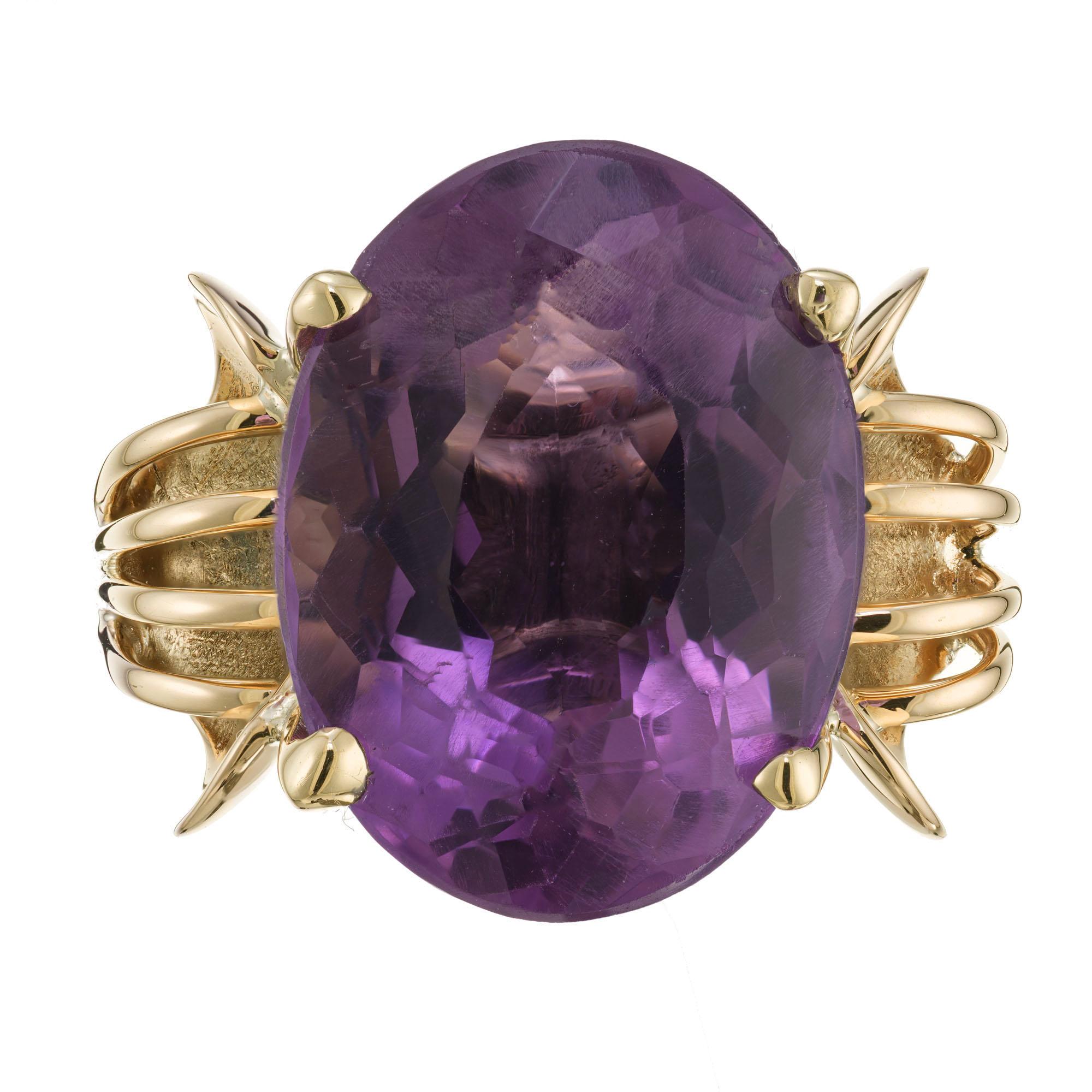 1940's amethyst cocktail ring. 12.50ct oval amethyst center stone, set in a hand made 14k yellow gold setting. 

1 natural bright medium 17.8 x 13.5mm purple Amethyst, approx. total weight 12.50cts
Size 7 and sizable
14k Yellow Gold
10.6 grams
Width
