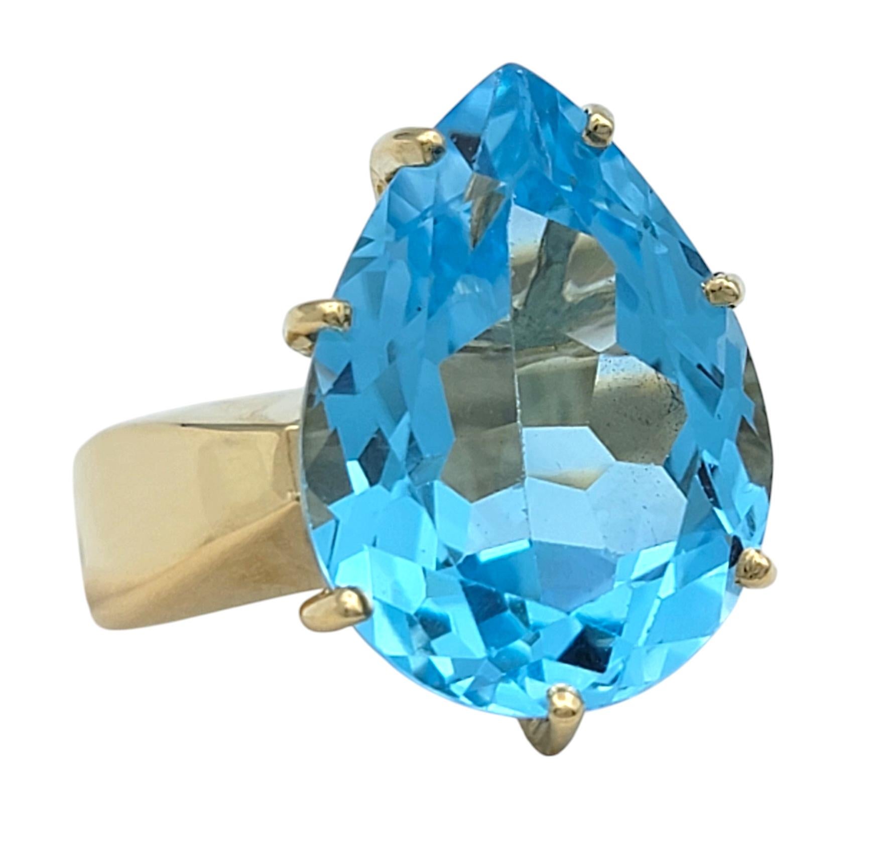 Contemporary 12.50 Carat Pear Cut Blue Topaz Solitaire Wide Band Ring in 14 Karat Yellow Gold For Sale