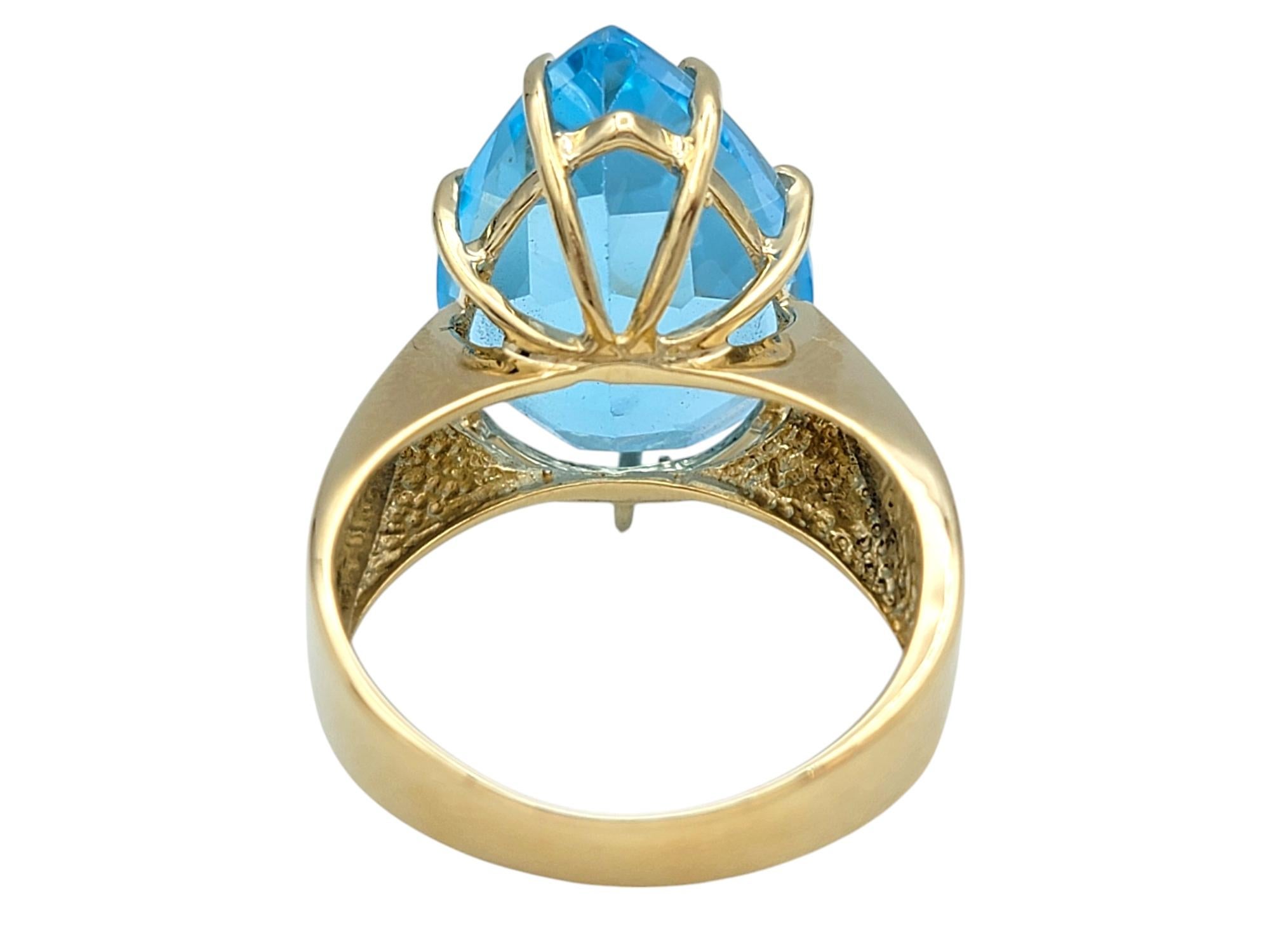 12.50 Carat Pear Cut Blue Topaz Solitaire Wide Band Ring in 14 Karat Yellow Gold For Sale 1