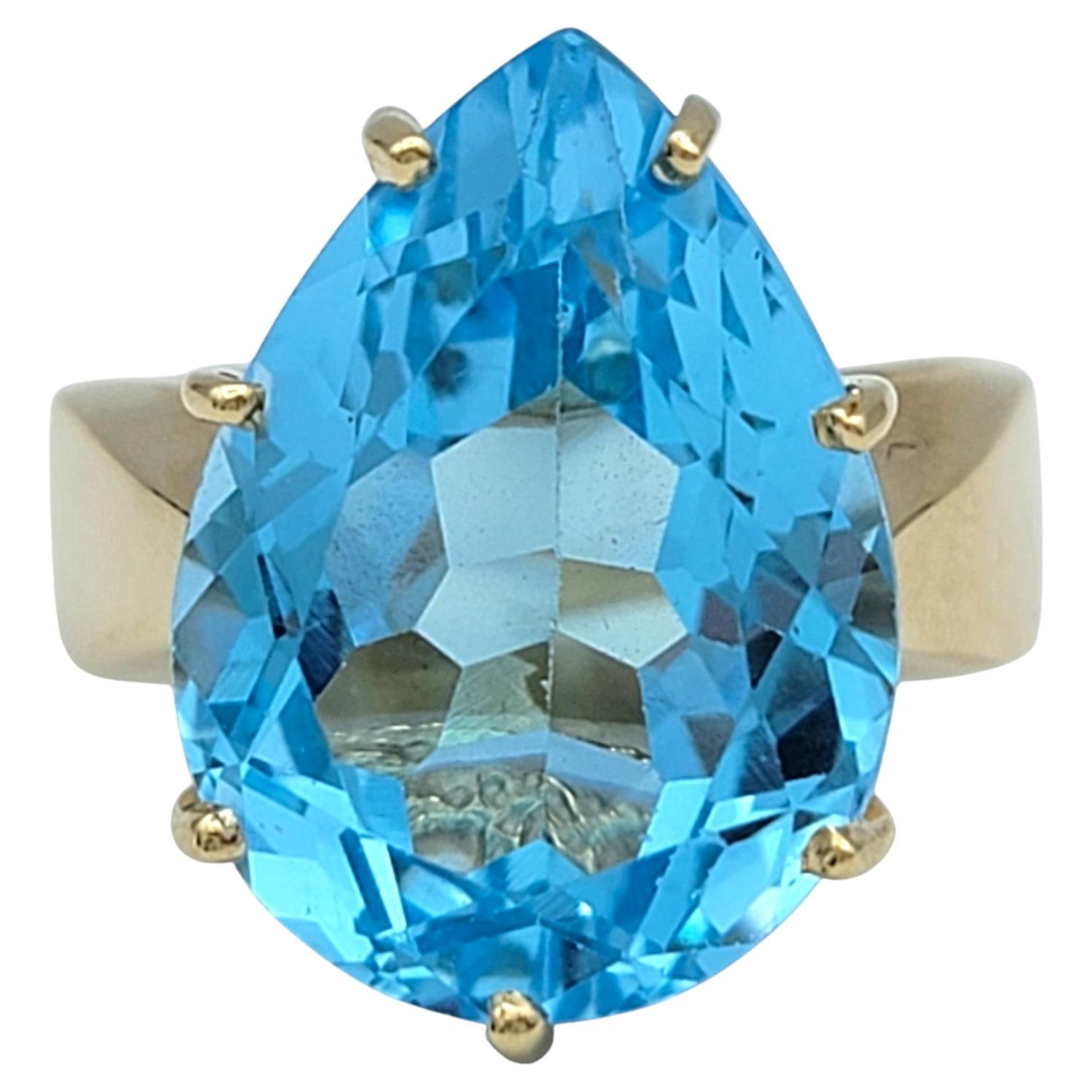 12.50 Carat Pear Cut Blue Topaz Solitaire Wide Band Ring in 14 Karat Yellow Gold