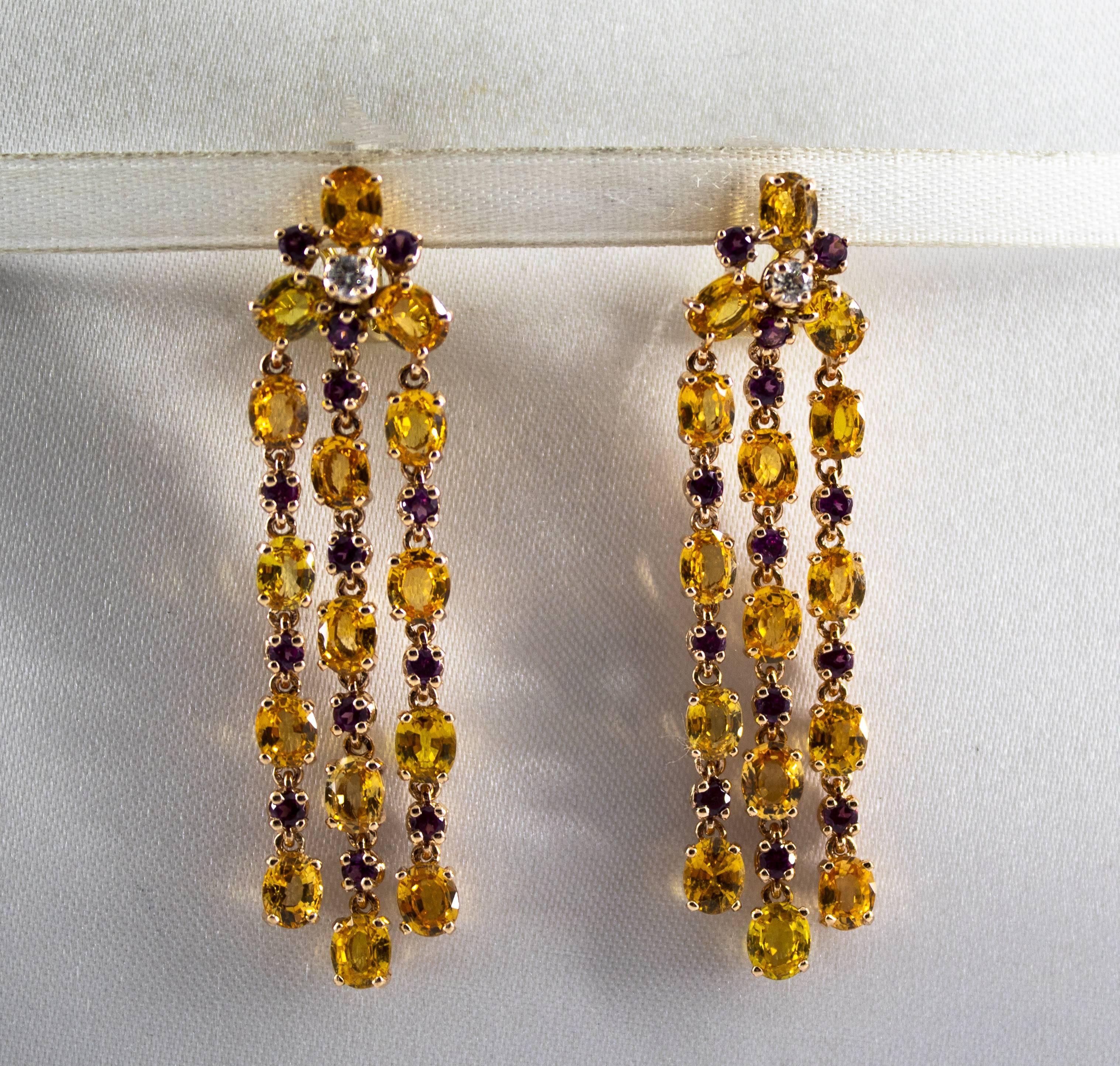 These Earrings are made of 14K Yellow Gold with 18K Yellow Gold Clips.
These Earrings have 0.14 Carats of White Diamonds.
These Earrings have 12.50 Carats of Yellow Sapphires.
These Earrings have 1.10 Carats of Rhodolite Garnets.
All our Earrings