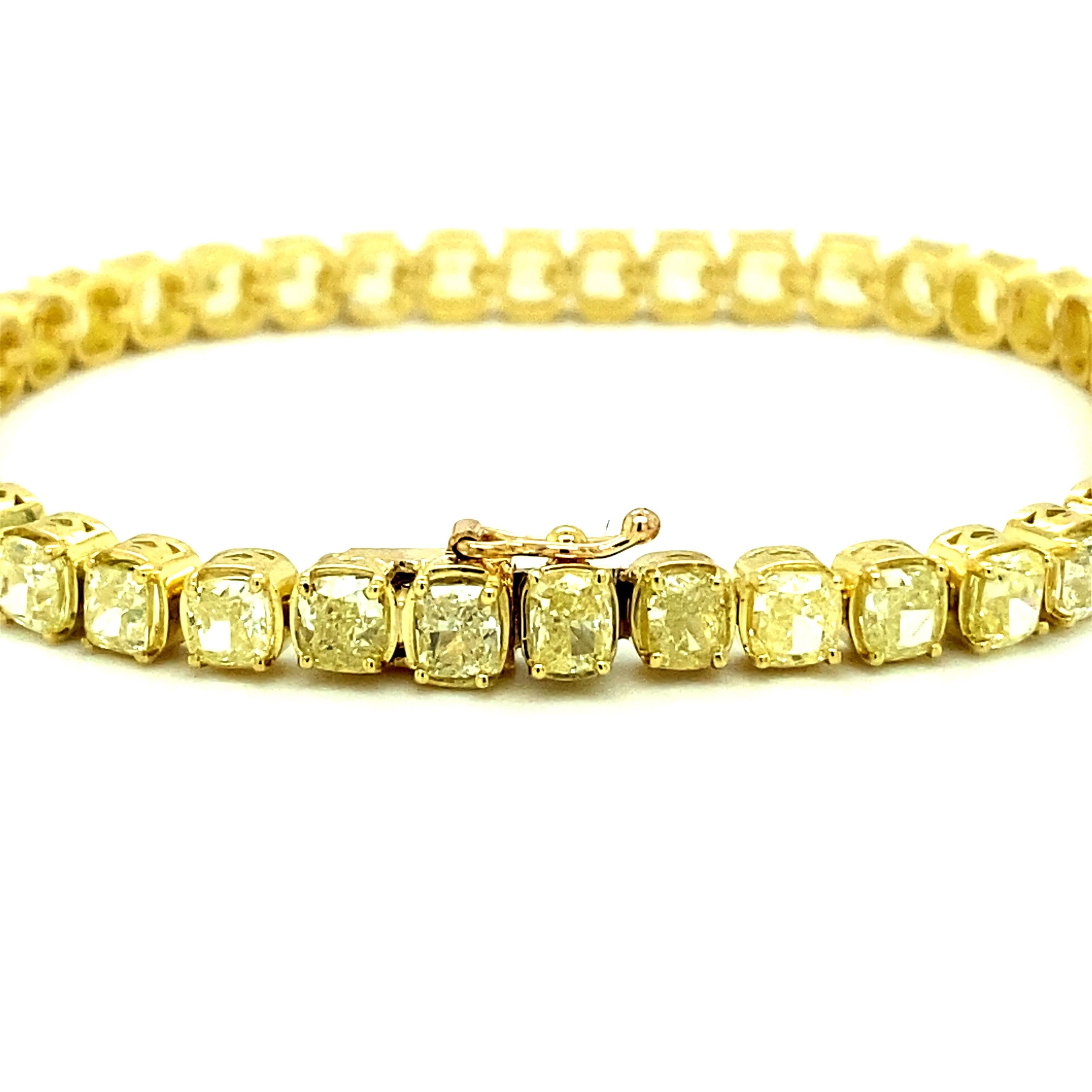 Offered here is a gorgeous Natural Yellow Diamond Tennis Bracelet in 18kt Yellow Gold. 
Diamond: 45 natural brilliant cut diamonds with an estimated total weight of 12.50 ct. Clarity is VS2-SI1. 
Weight: 20.20 gr. 
Length: 7 1/2 inches long & 4.65