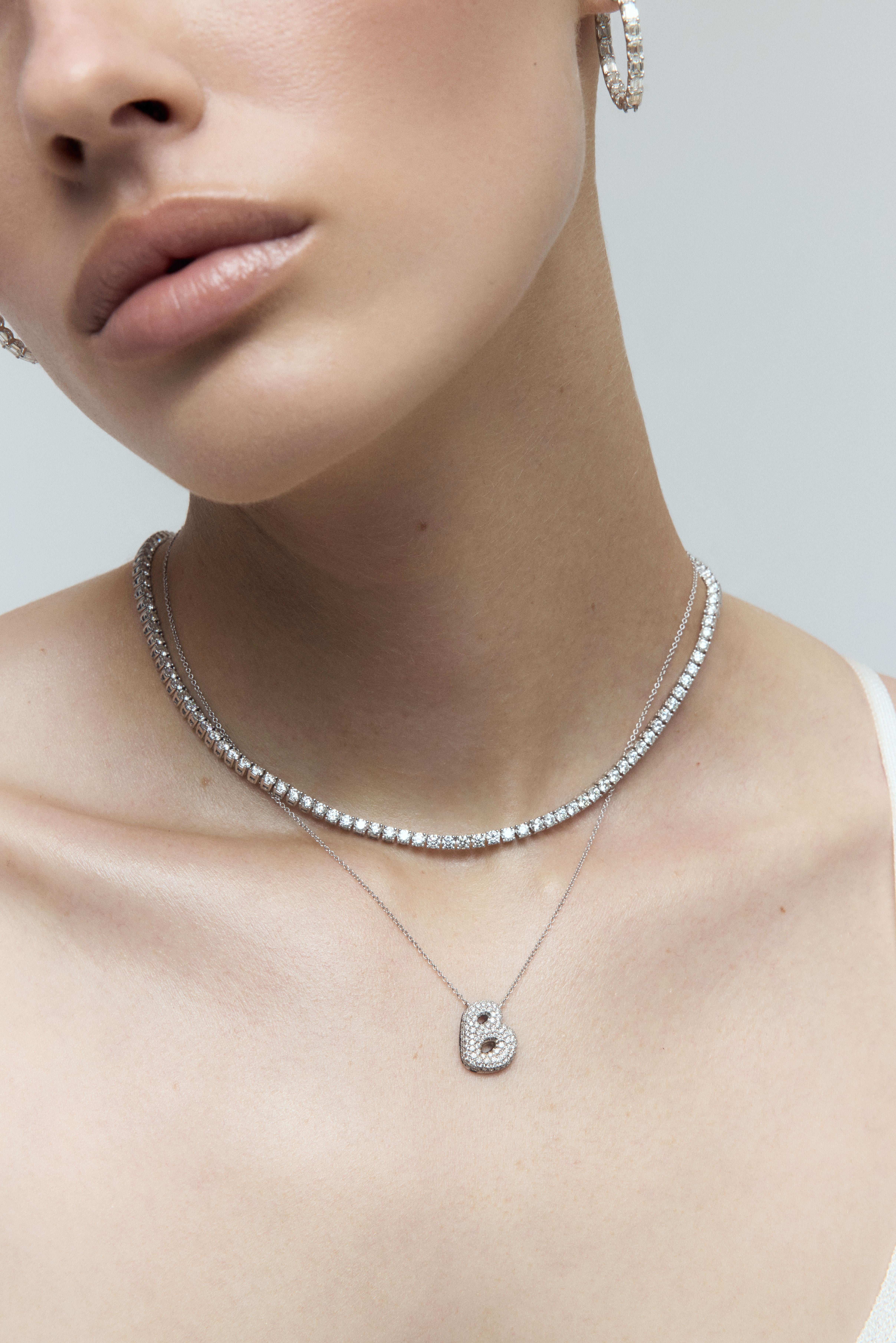 An icon of timeless luxury, the Classic Round Diamond Tennis Necklace is a breathtaking expression of elegance and refinement. Designed to highlight the unparalleled brilliance of perfectly matched round brilliant-cut diamonds, this signature Alder