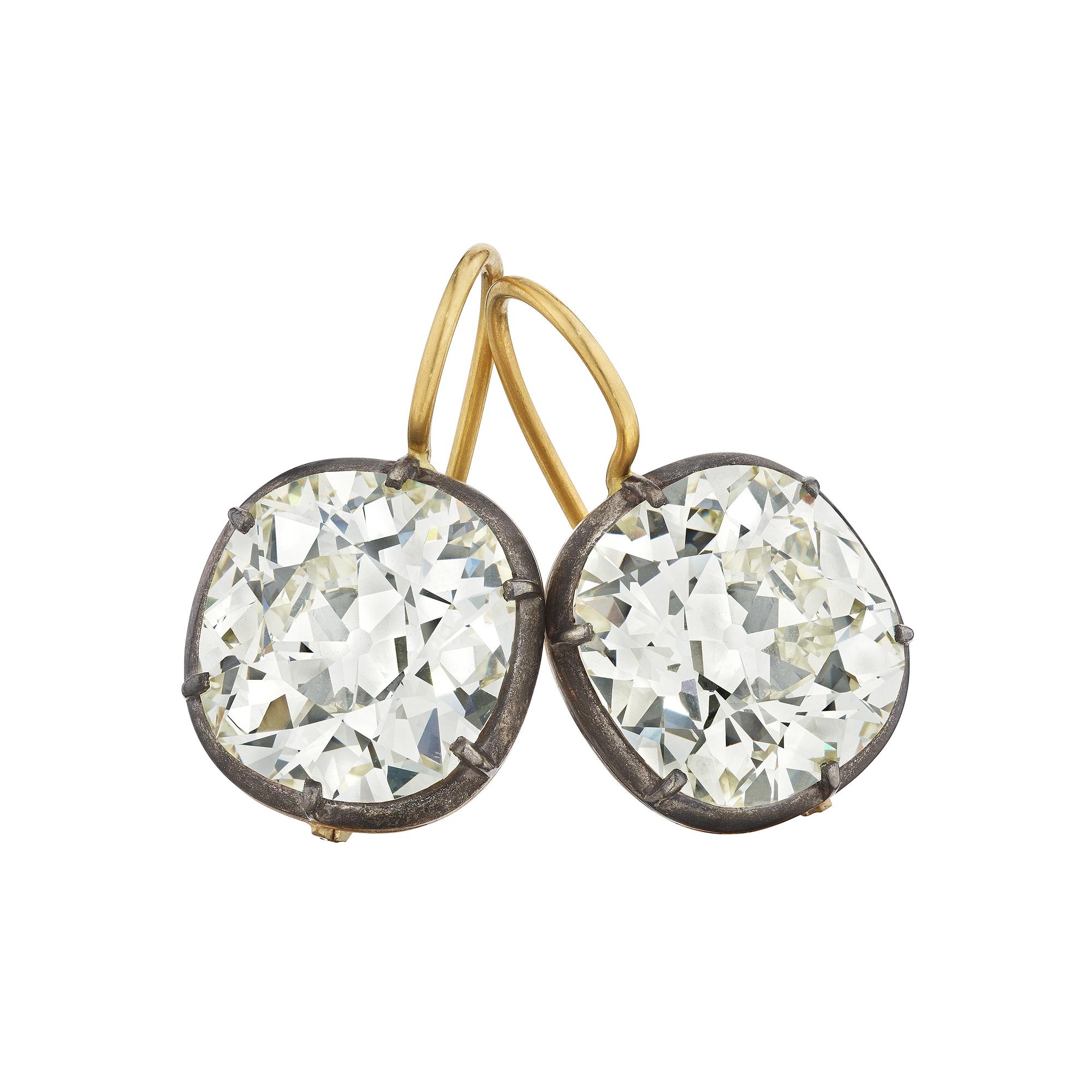 Bold and uncompromising these total weight 12.51 carat vintage cushion brilliant cut diamond, silver, and 18 karat yellow gold drop earrings are rare to find but easy to wear.  GIA certification numbers 6223757499 and 5222757508.  Color Q-R/W-X. 