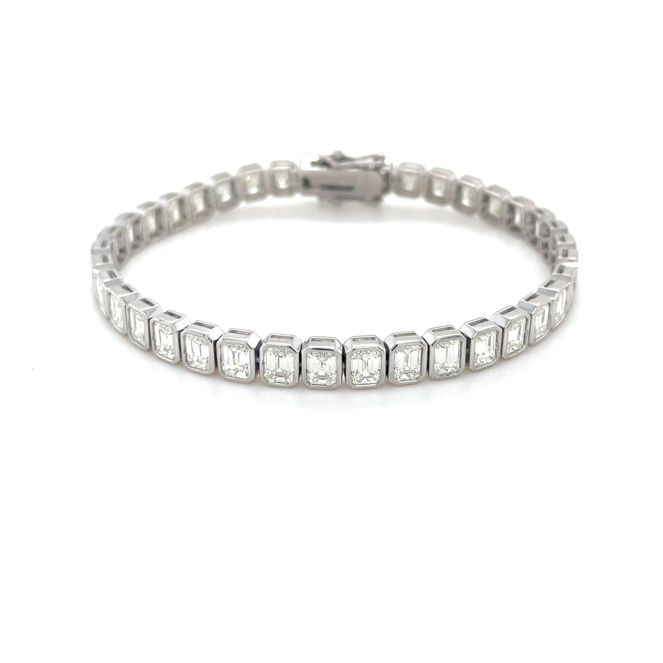 Classic with a twist, this bracelet contains 38 bezel set emerald cut diamonds weighing 12.52 carats total. Crafted in platinum, this bracelet is extremely well made and a perfect addition to your collection.

Stamp: PLAT
Material: Platinum
Gross