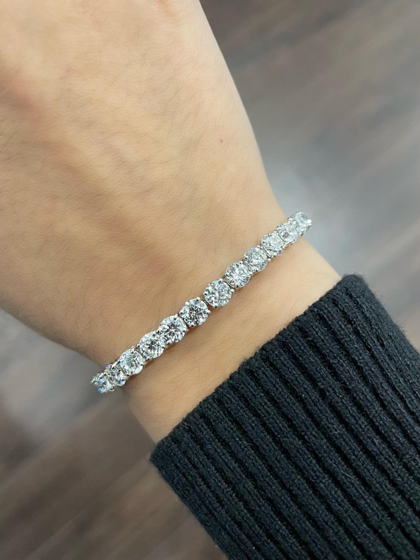 The 12.52 ct Platinum Round Diamond Tennis Bracelet is a truly breathtaking piece of jewelry that showcases the beauty and brilliance of high-quality diamonds. This bracelet features a stunning row of 12.52 carats of round diamonds that have been