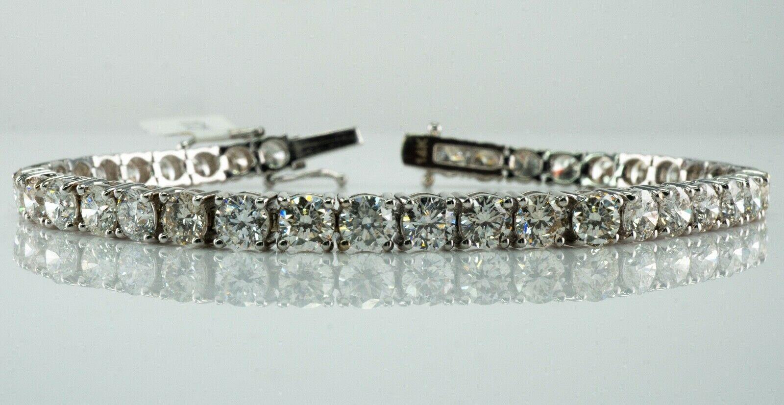 This amazing estate tennis bracelet is crafted in solid 14K White gold and set with white and fiery round brilliant cut diamonds. 
There are 38 diamonds, .33 carats each of SI1 clarity and H color totaling 12.53 carats. 
The width of the bracelet is