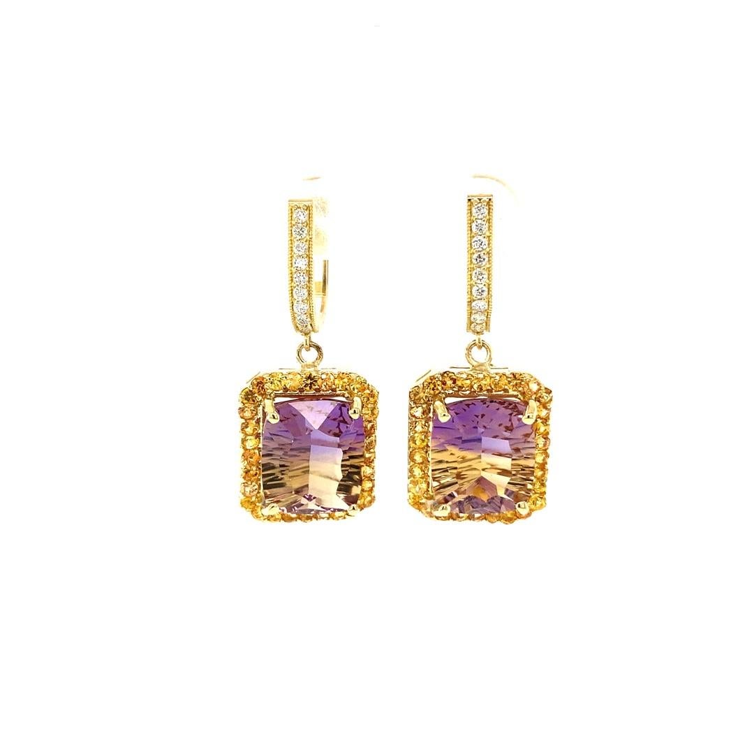 Ametrine, Yellow Sapphire and Diamond Drop Earrings! 

These Earrings definitely have a WOW factor! 
Flashing a vivid color of yellow and purple the vibrant Emerald Cut Ametrine sits between Yellow Sapphires and Diamond accents. 

Item Specs: 
2