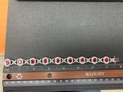 12.54 Carat Oval Cut Ruby and Diamond Tennis Bracelet in 14K White Gold