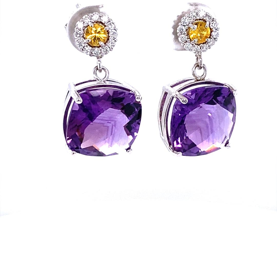 Amethyst, Yellow Sapphire and Diamond Drop Earrings! 

These cute and dainty Earrings have 2 large Cushion Cut Amethysts that weigh 11.86 Carats and are embellished with 24 Round Cut Diamonds that weigh 0.28 Carats and 2 Yellow Sapphires that weigh