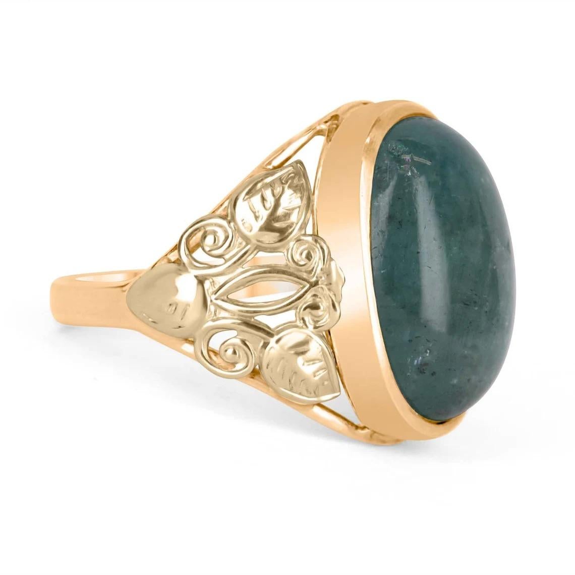Featured is this exquisite barrel cabochon solitaire ring. The center stone has a full 12.56-carats of a natural barrel cabochon with light bluish-green color. That large stone is set into a fully custom, floral 14K yellow gold setting design. The