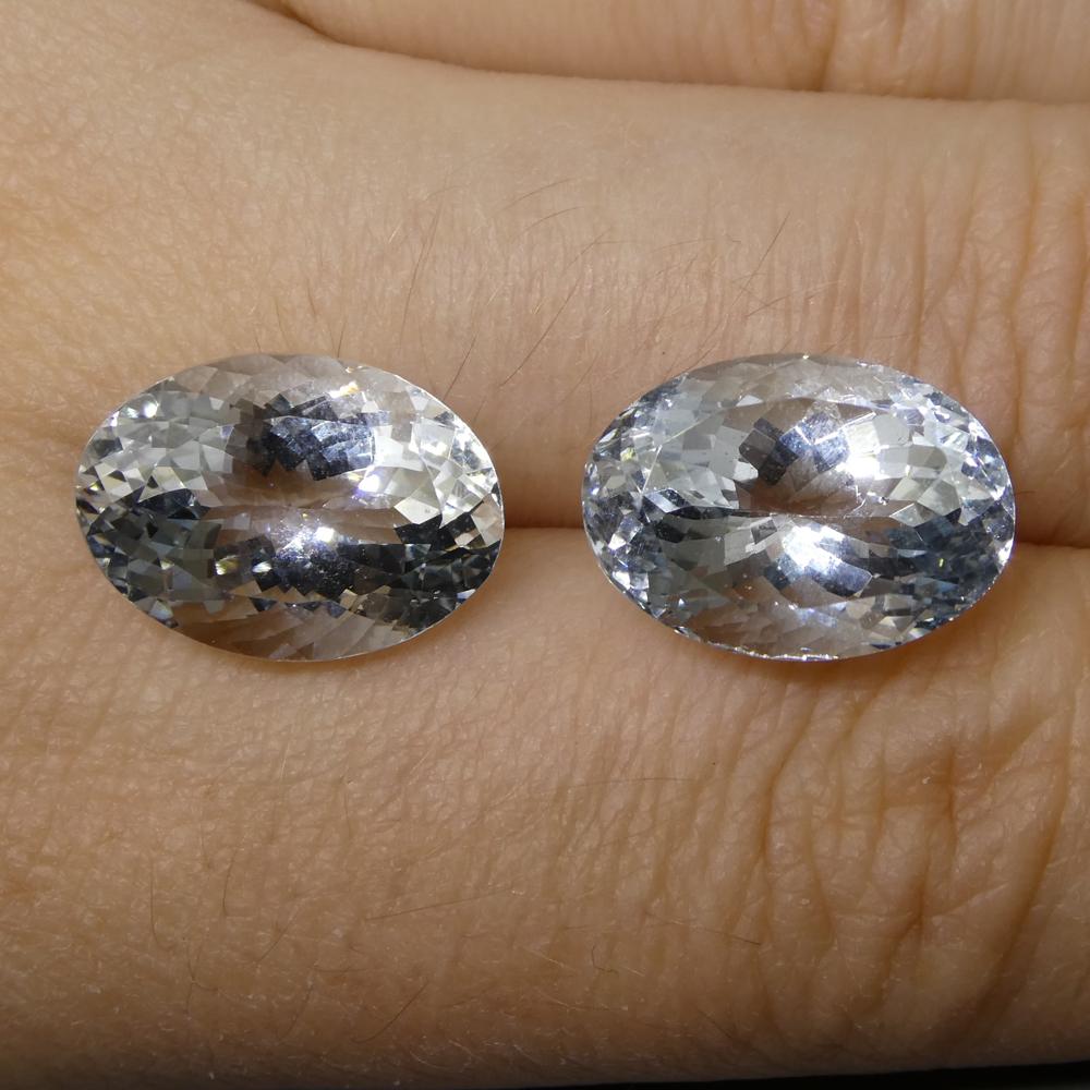 Description:

Gem Type: Aquamarine 
Number of Stones: 2
Weight: 12.58 cts
Measurements: 14.60x10.10x8.00 mm
Shape: Oval
Cutting Style Crown: Modified Brilliant Cut
Cutting Style Pavilion: Mixed Cut  
Transparency: Transparent
Clarity: Very Very