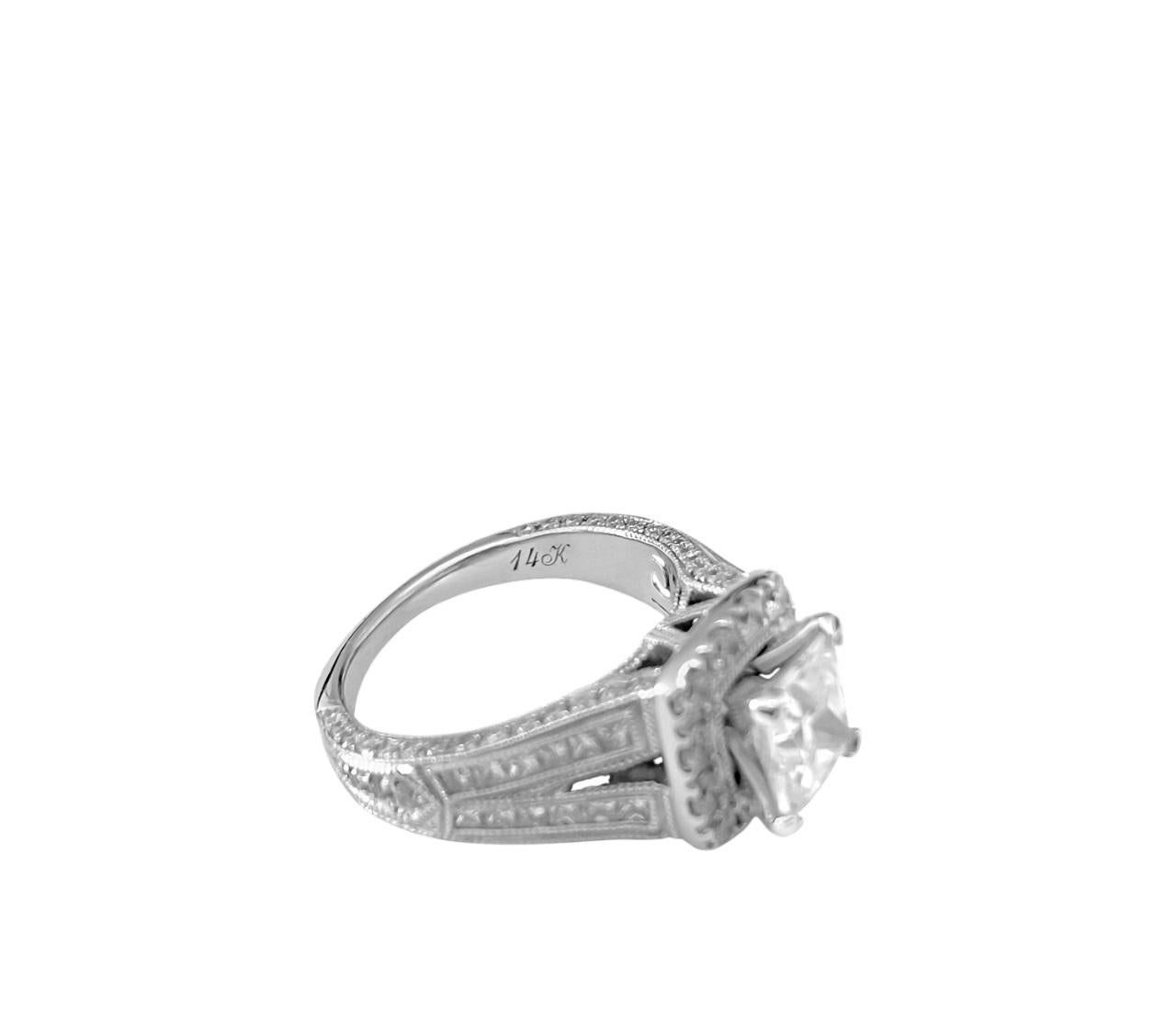 Presenting this stunning engagement ring crafted from 14k white gold, featuring a dazzling 1.25 carat cubic zirconia center stone in a 6.00mm princess cut, elegantly set in prongs. Accentuating the centerpiece are 1.70 carats of side diamonds,