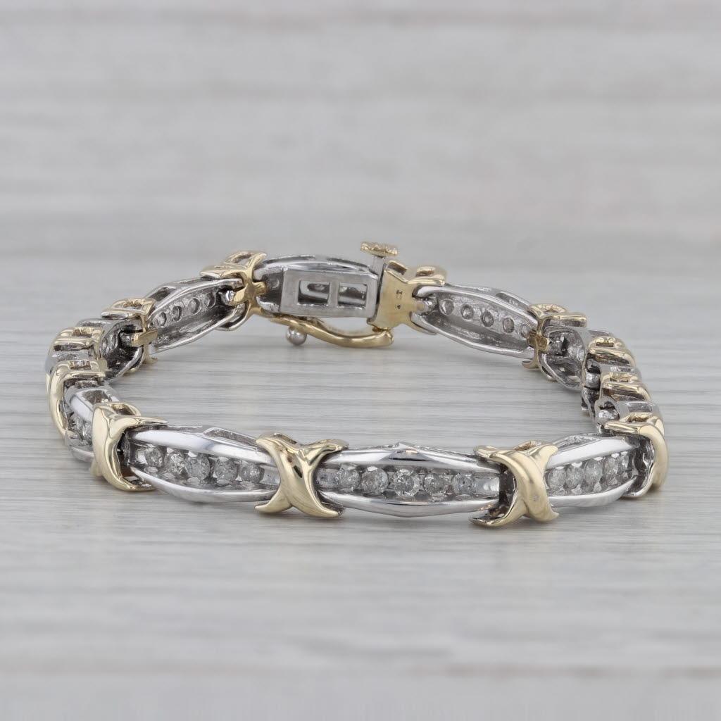 Gemstone Information:
- Natural Diamonds -
Total Carats - 1.25ctw
Cut - Round Brilliant
Color - I - J
Clarity - I1 - I2

Metal: 10k Yellow & White Gold 
Weight: 16.5 Grams 
Stamps: 10k
Chain Style: Bar X Links
Closure: Snap & Latch
Inner