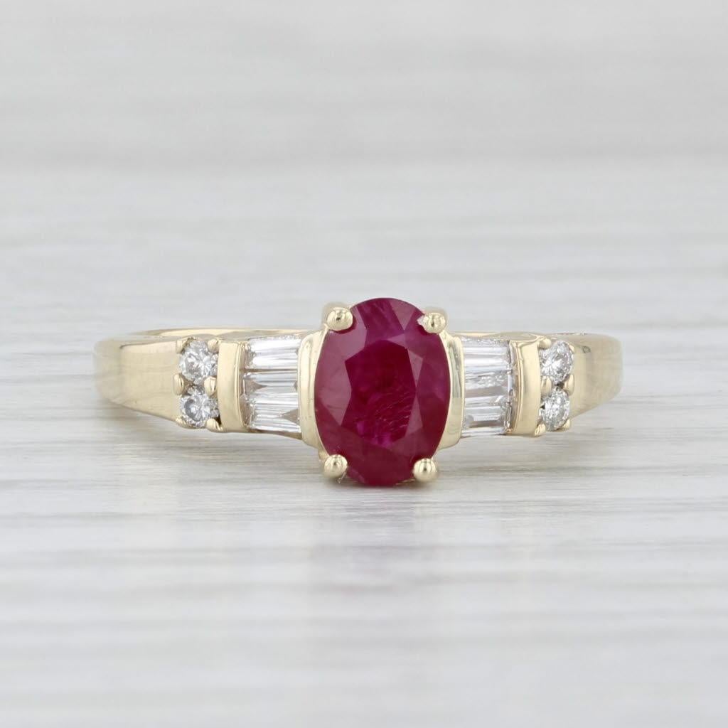 Gemstone Information:
- Natural Ruby -
Carats - 1ct 
Cut - Oval
Color - Red
Treatment - Routinely Enhanced 

- Natural Diamonds -
Total Carats - 0.25ctw
Cut - Round Brilliant & Baguette
Color - H - I
Clarity - SI2 - I1

Metal: 10k Yellow