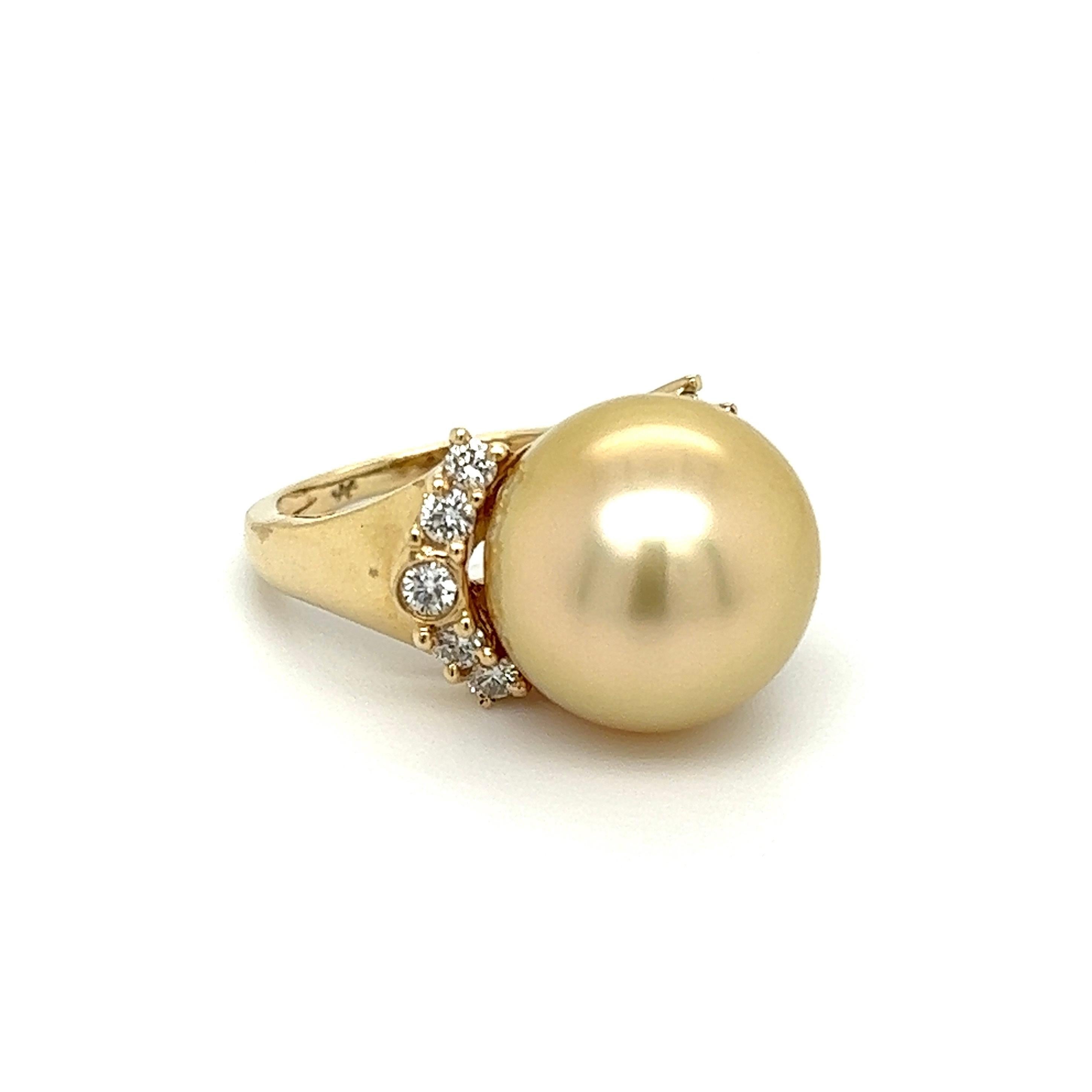 Simply Beautiful! Finely detailed Golden South Sea Pearl and Diamond Cocktail Ring. Centering a securely nestled Hand set 12.5mm South Sea Pearl, enhanced with Hand set Diamonds, weighing approx. 0.30 total carat weight. Dimensions 1.16” l x 0.75” w