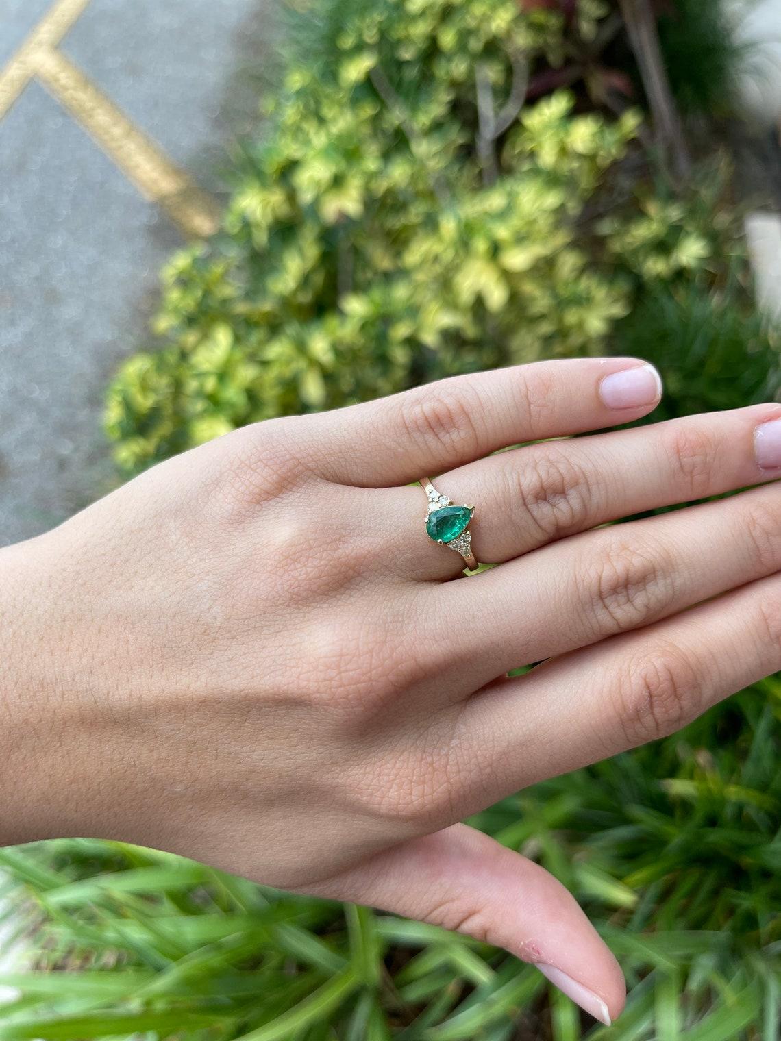 pear emerald engagement rings